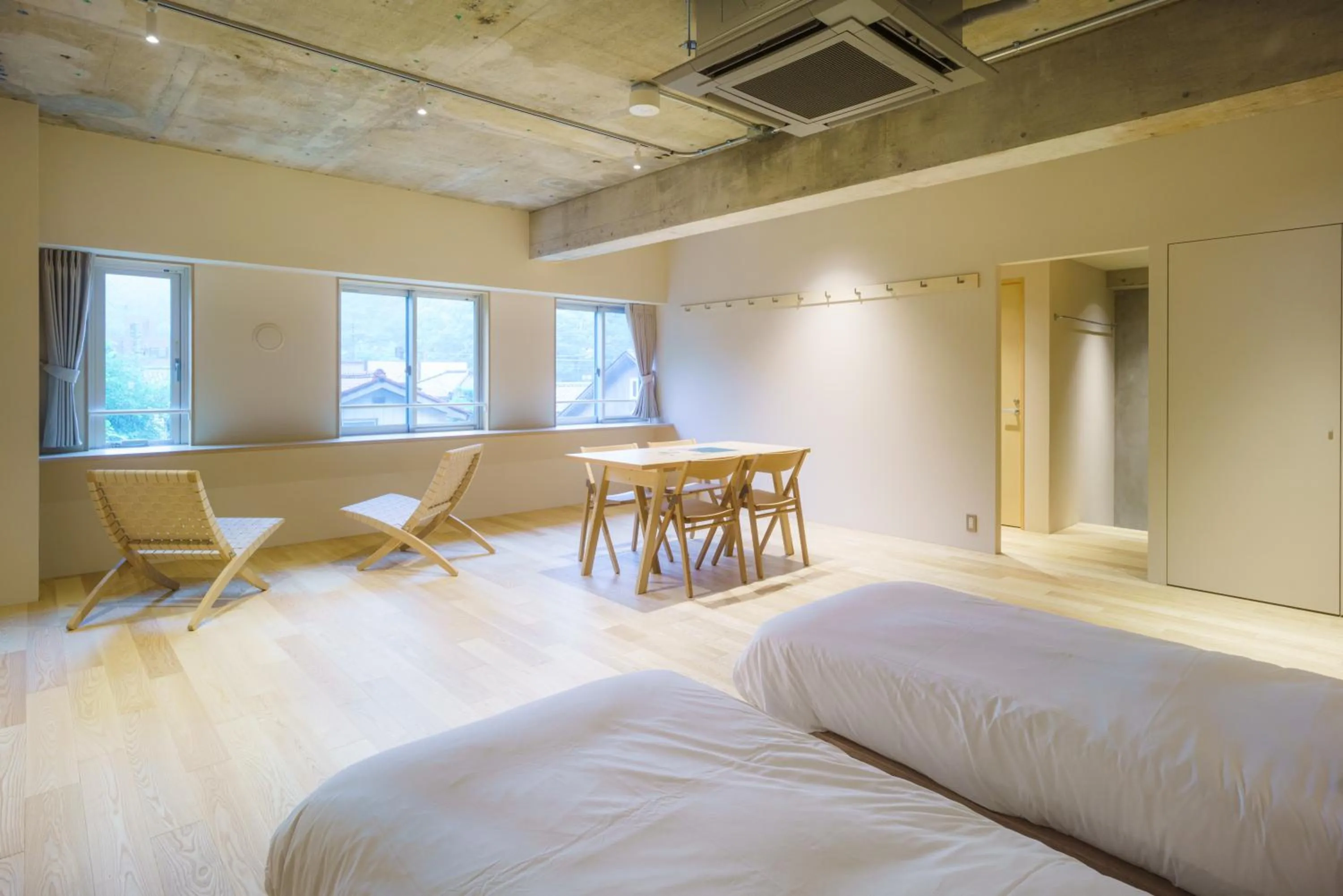 Bed in TAKAONE ACTIVITY＆STAY