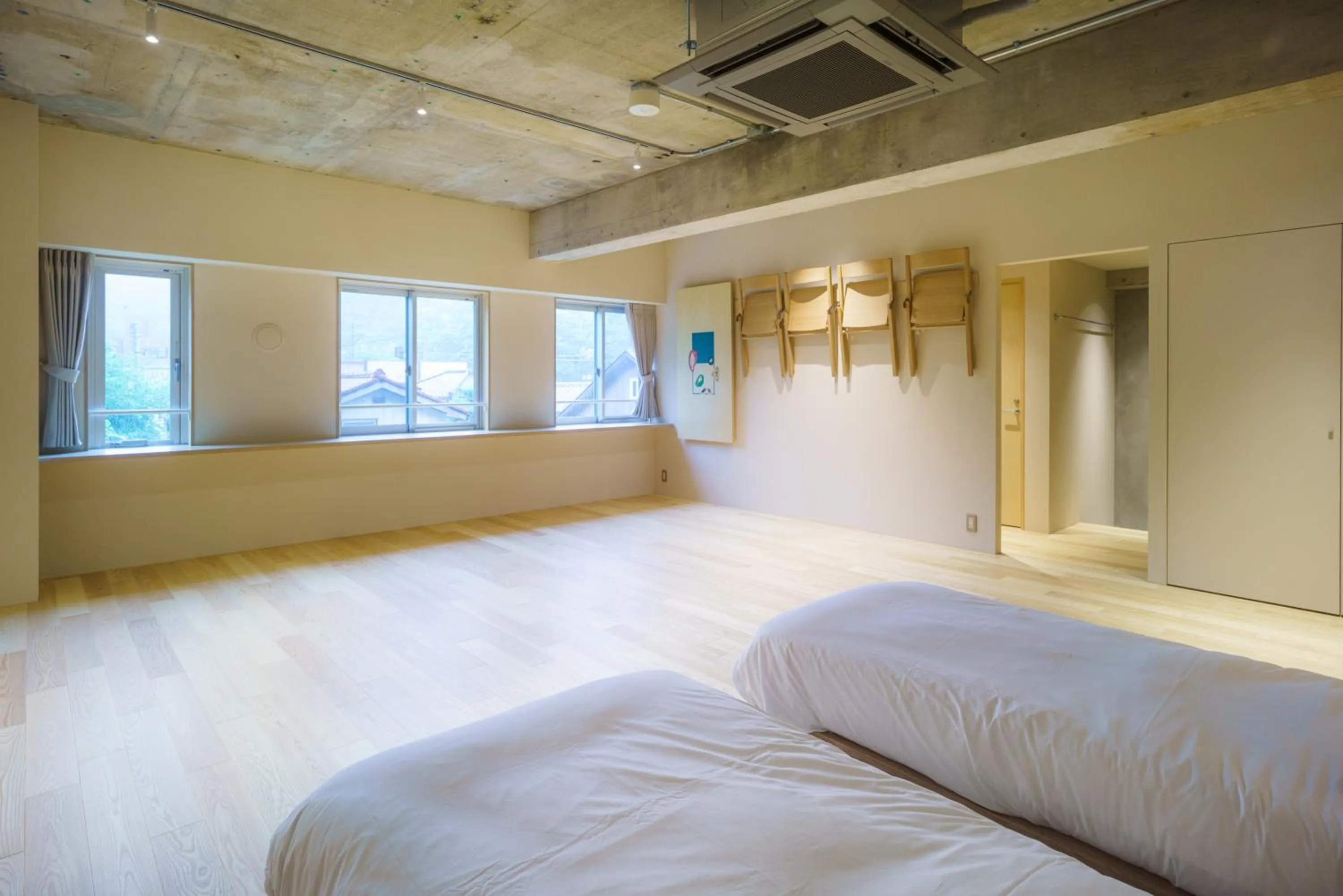 Bed in TAKAONE ACTIVITY＆STAY