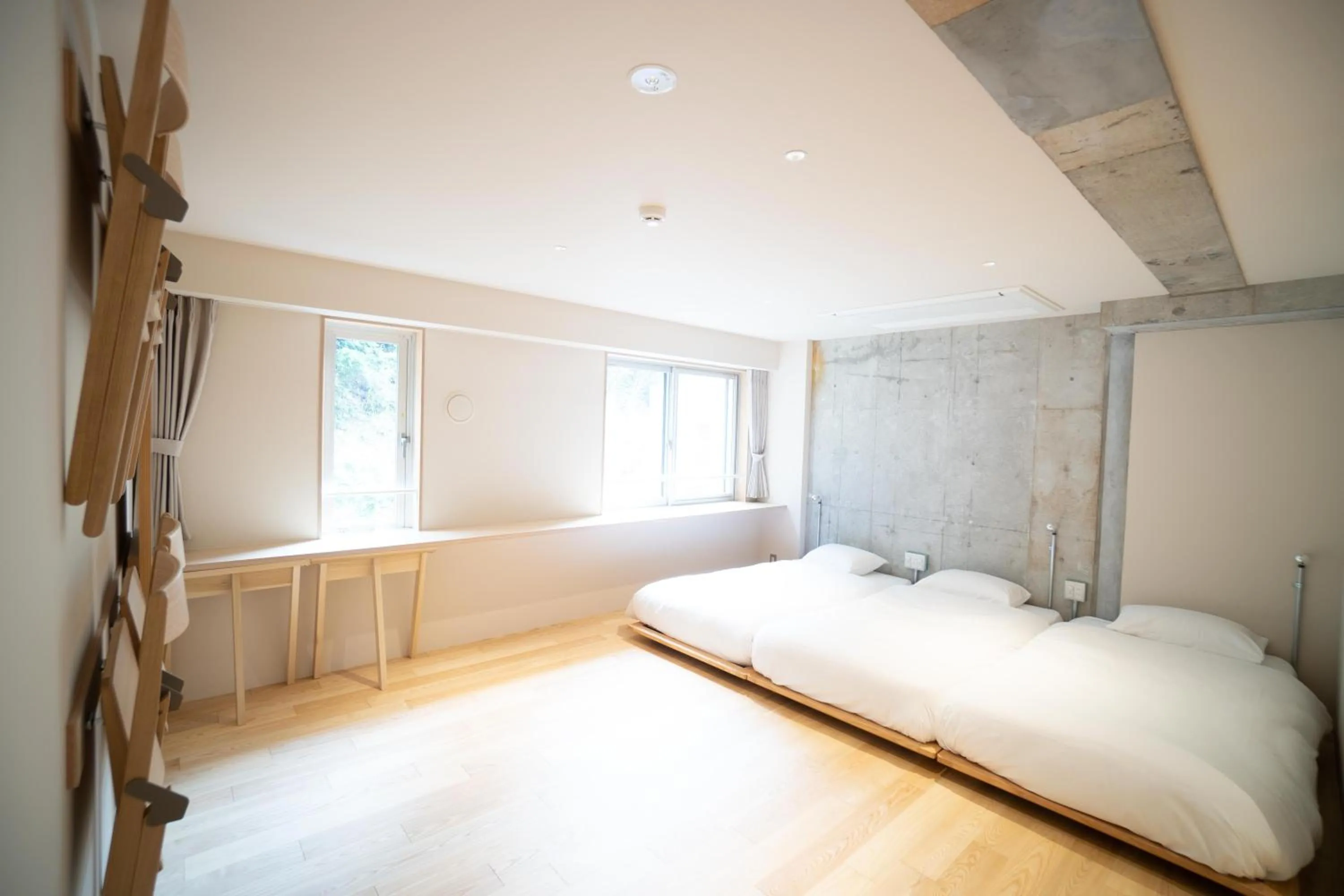 Bed in TAKAONE ACTIVITY＆STAY