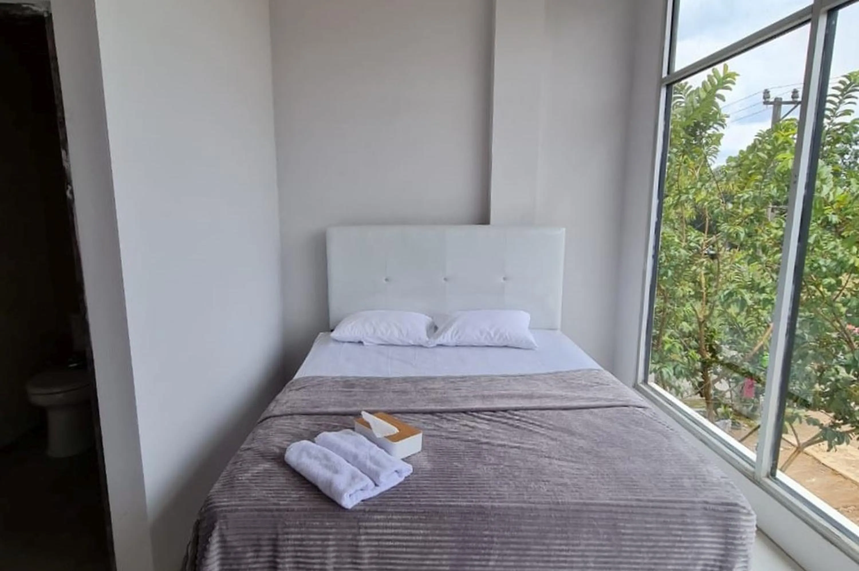 Bed in Krisan Guest House Syariah Banjarbaru Mitra RedDoorz