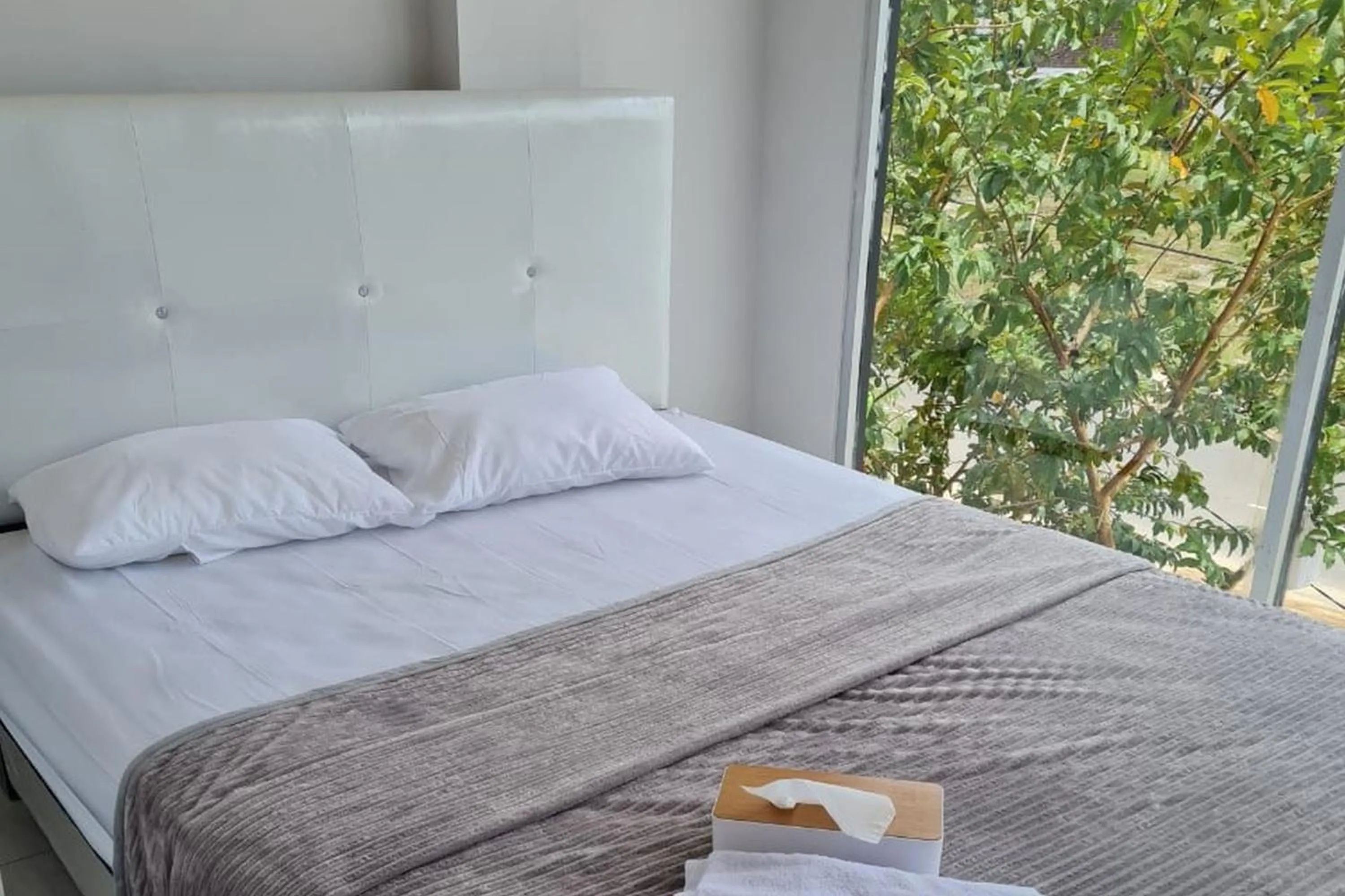 Bed in Krisan Guest House Syariah Banjarbaru Mitra RedDoorz