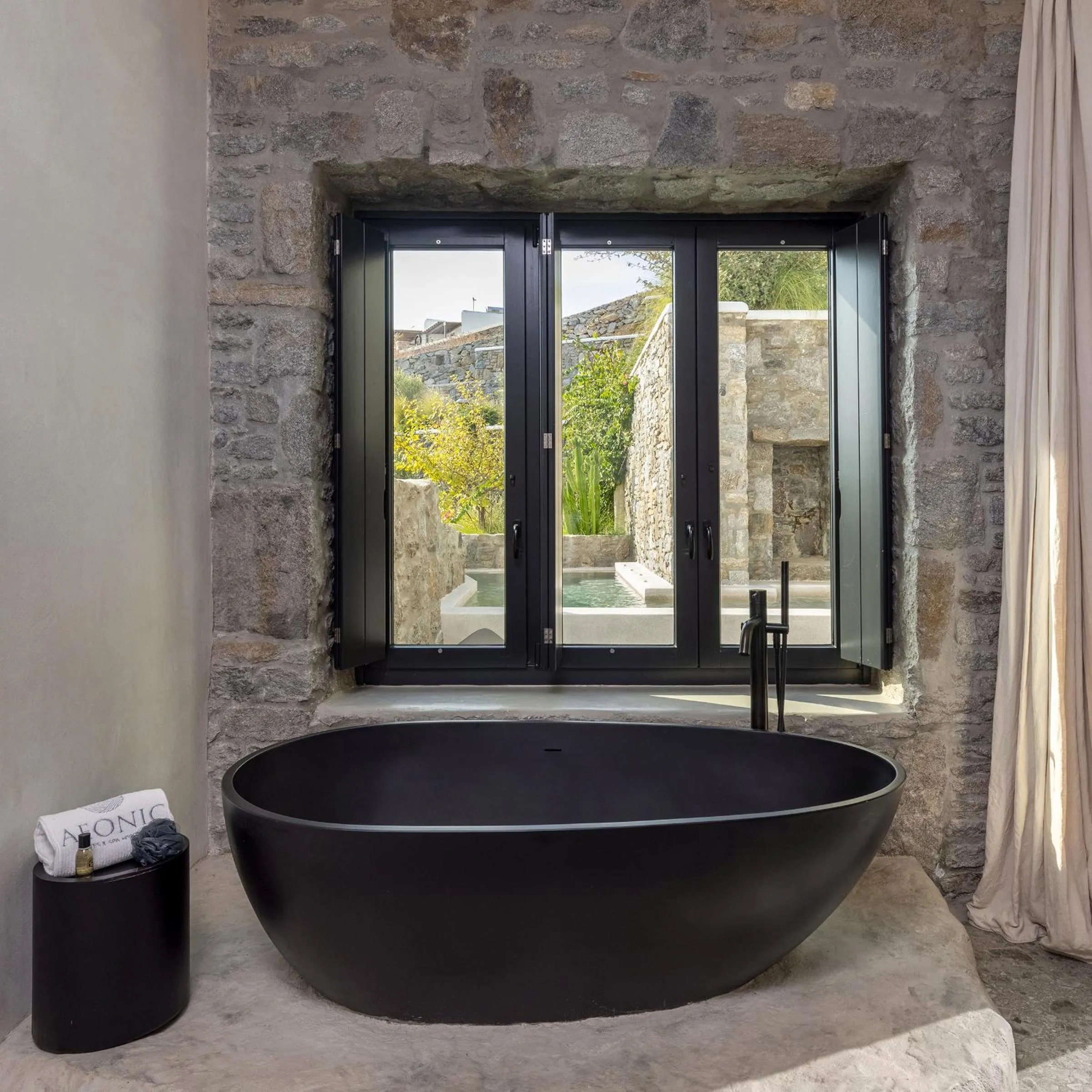 Bath in Aeonic Suites and Spa