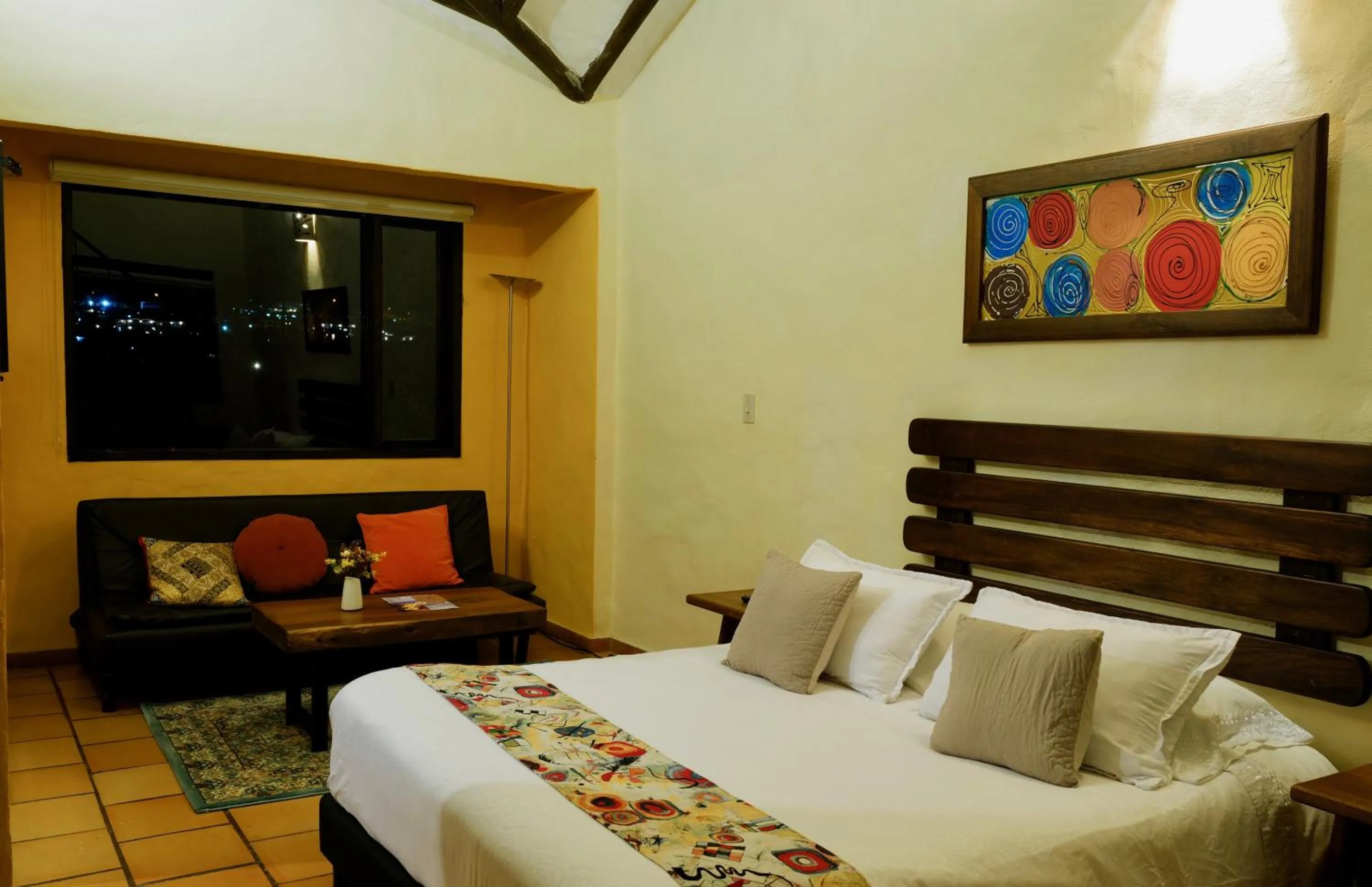 Living room, Bed in Bombon Hotel