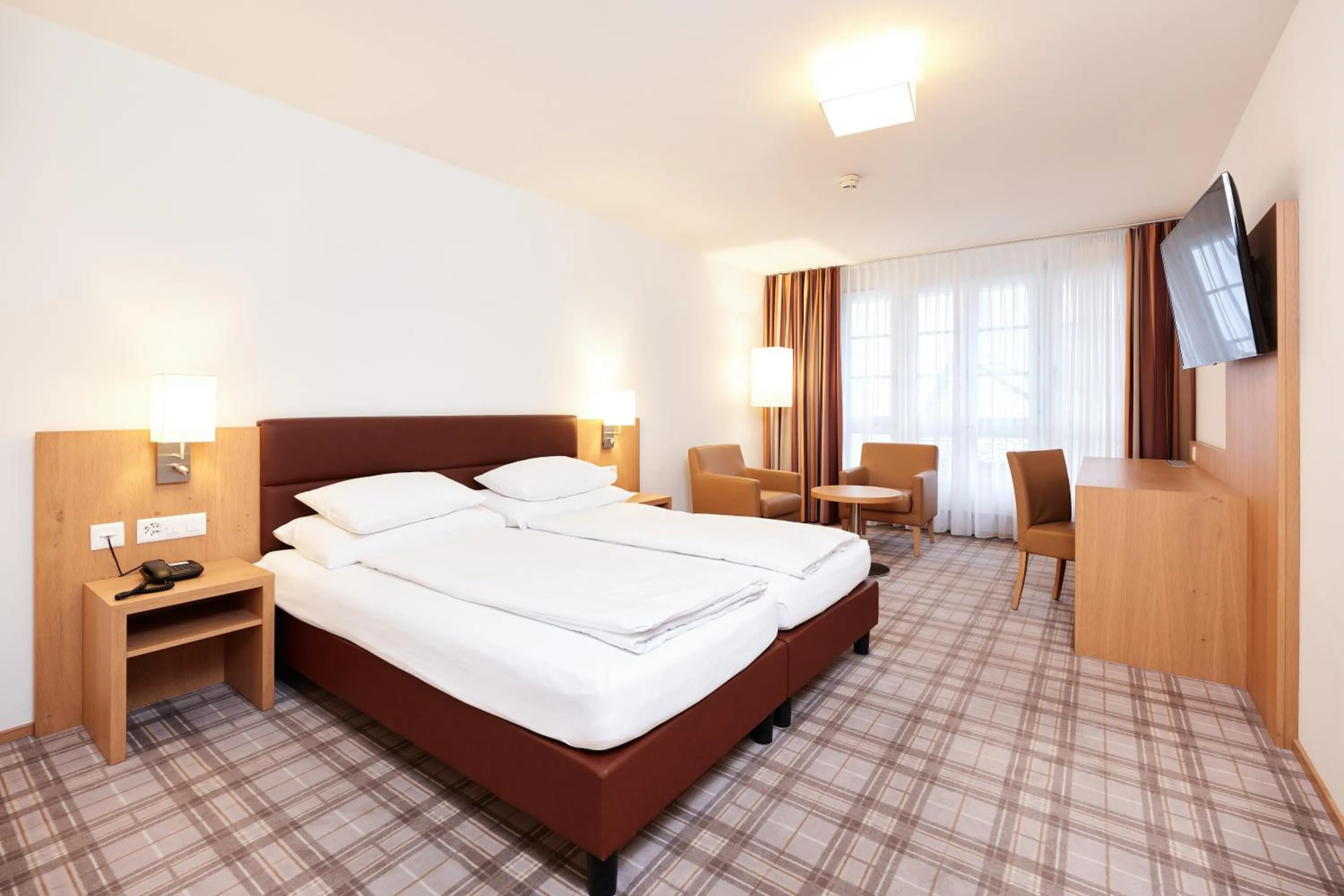 Bed in Central City Hotel Rochat