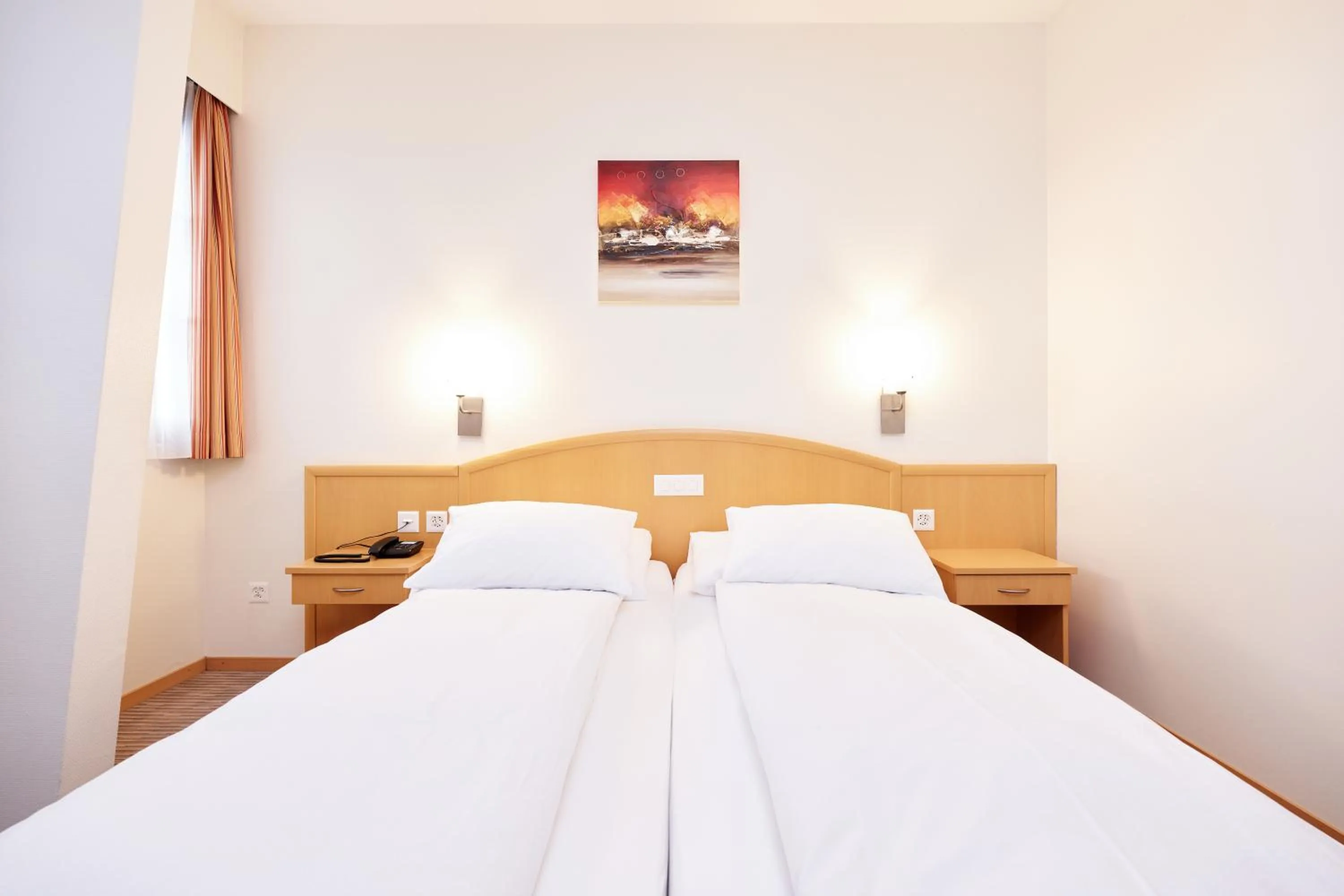 Bed in Central City Hotel Rochat