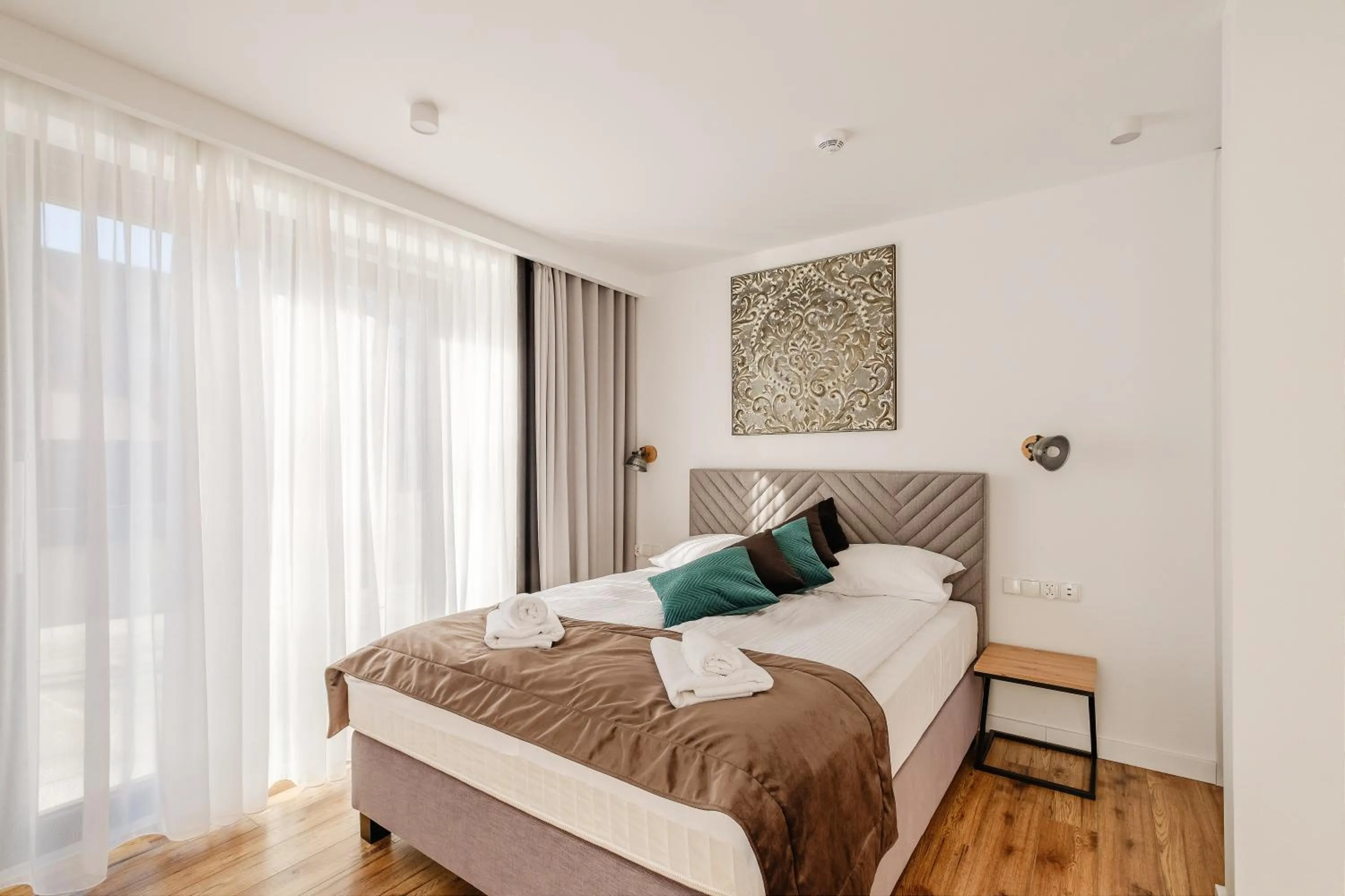 Bed in REZYDENCJA ORNAK 5 - stylowe apartamenty z balkonami i jacuzzi, 5 min pieszo do Krupówek, IZBY PODHALAŃSKIE