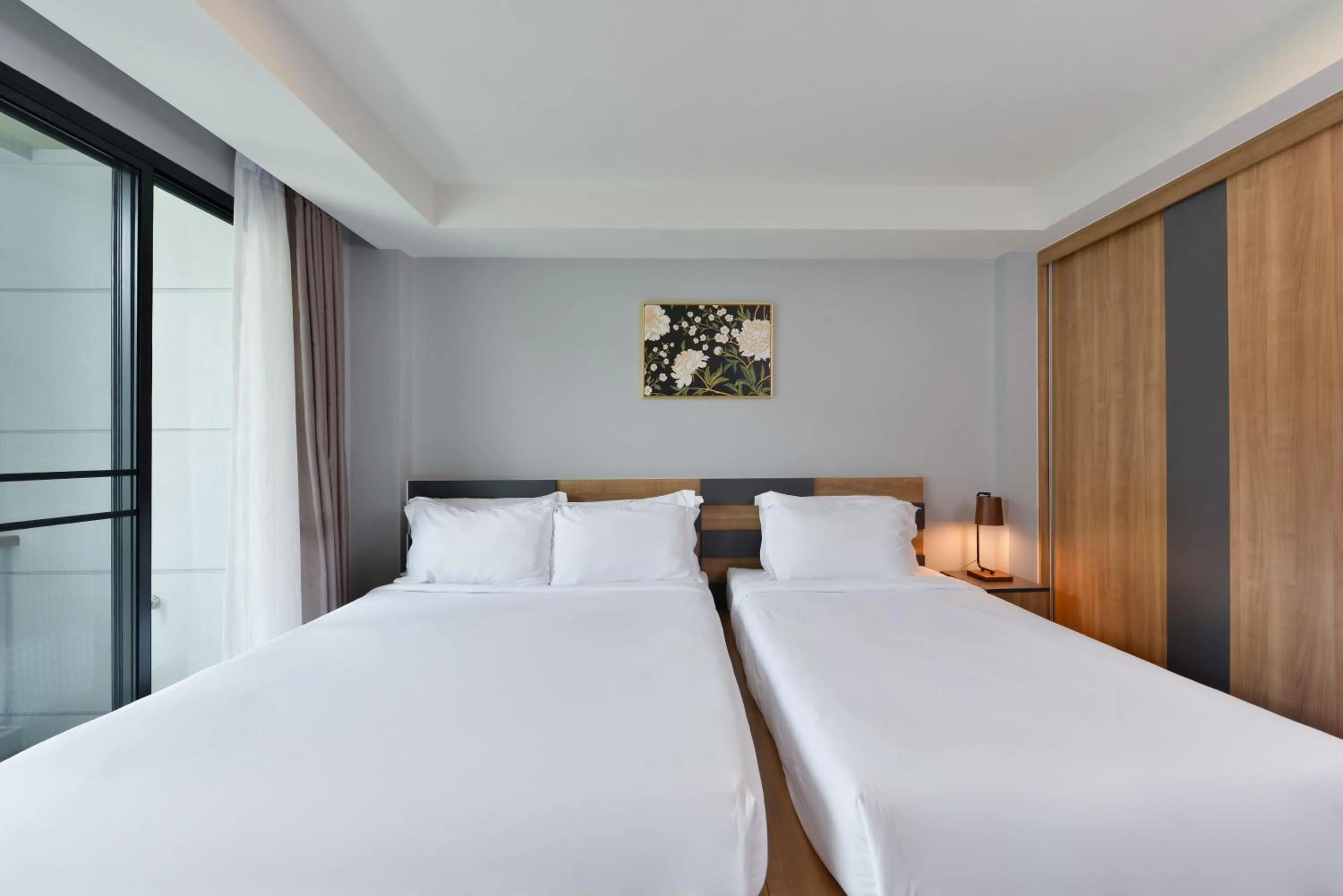 Bed in Raweewan Residence hotel