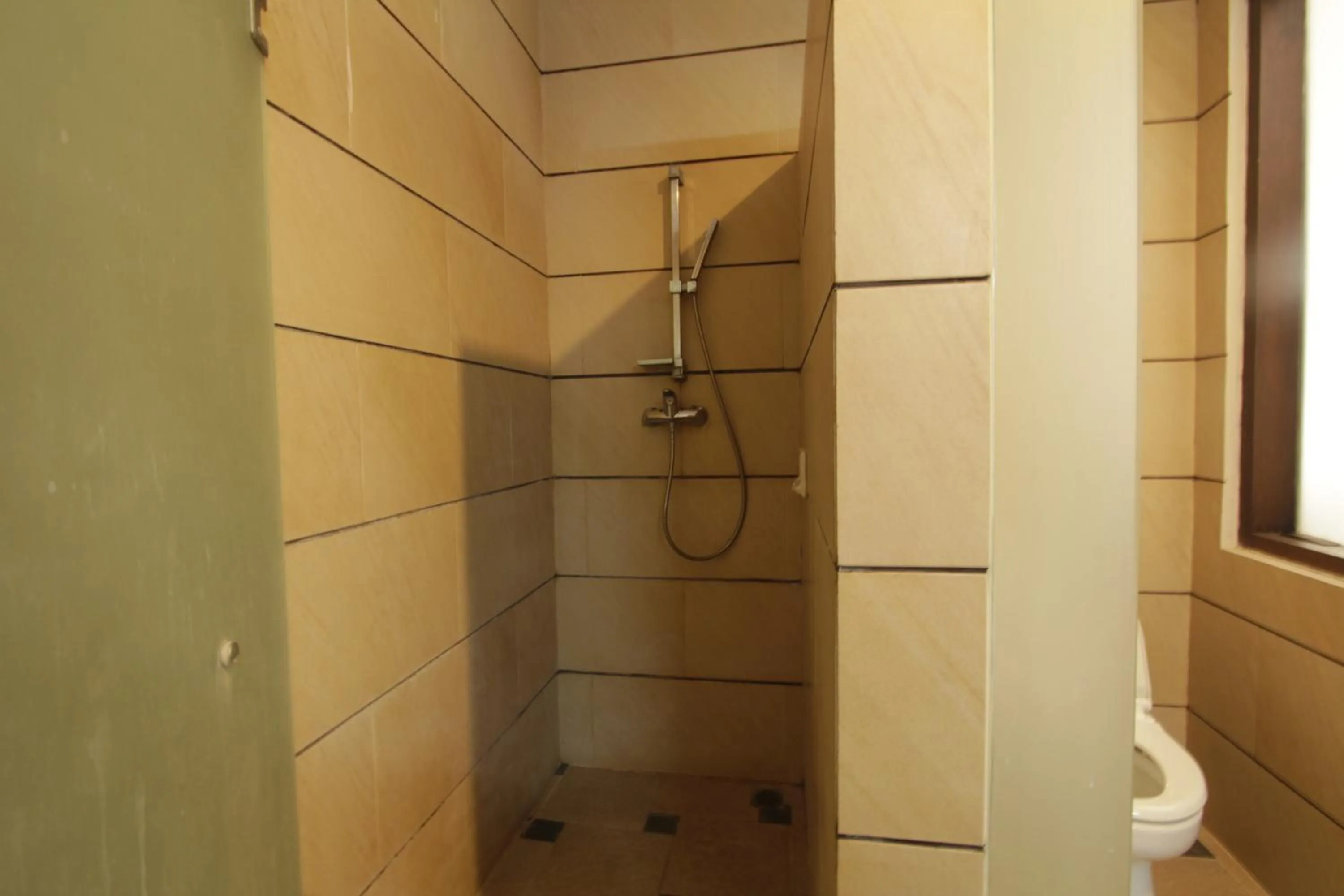 Bathroom in Alit Beach Resort and Villas