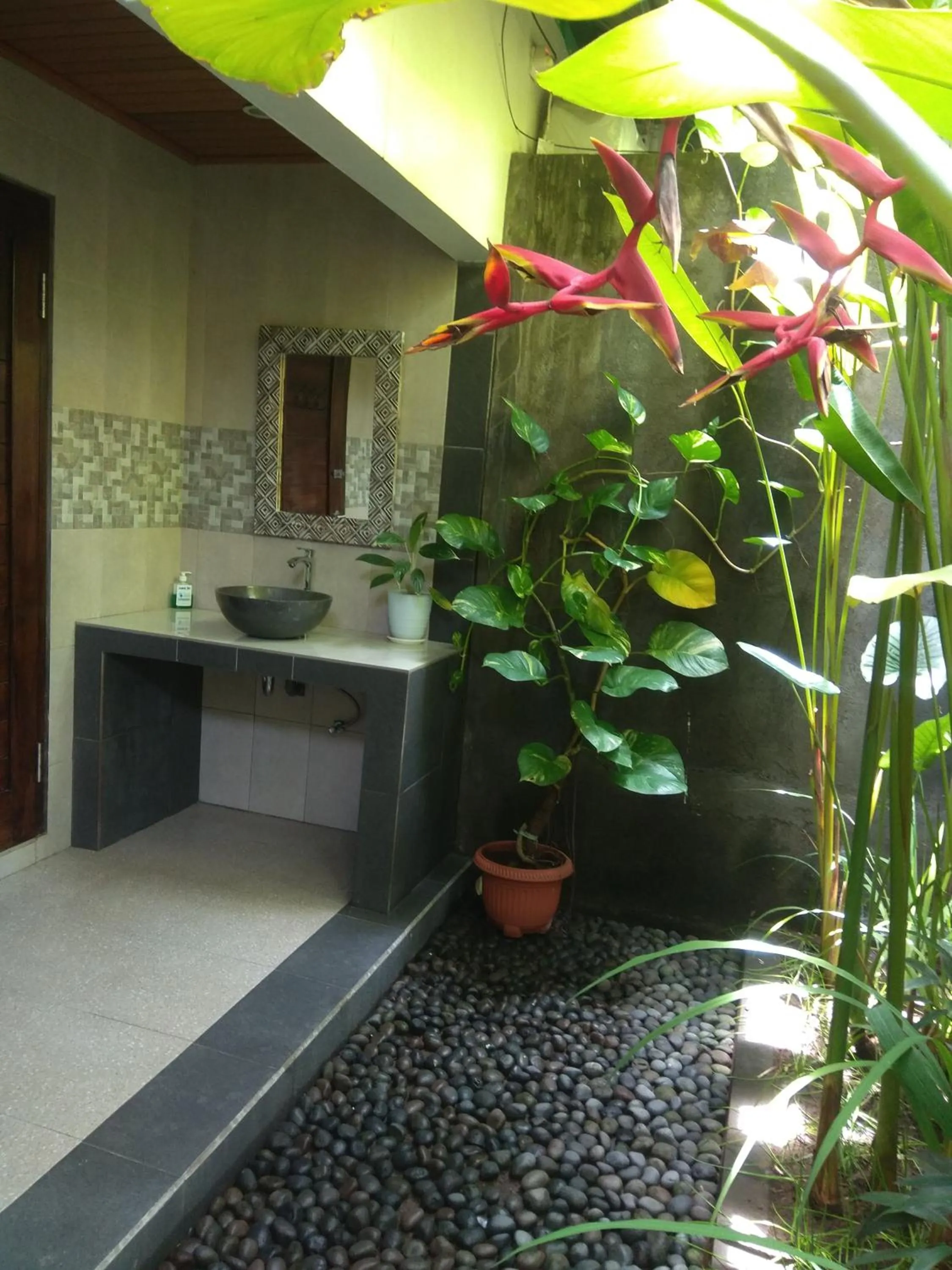 Bathroom in Tamiu Guesthouse at Desa Wisata Keramas Near Keramas Surf Beach