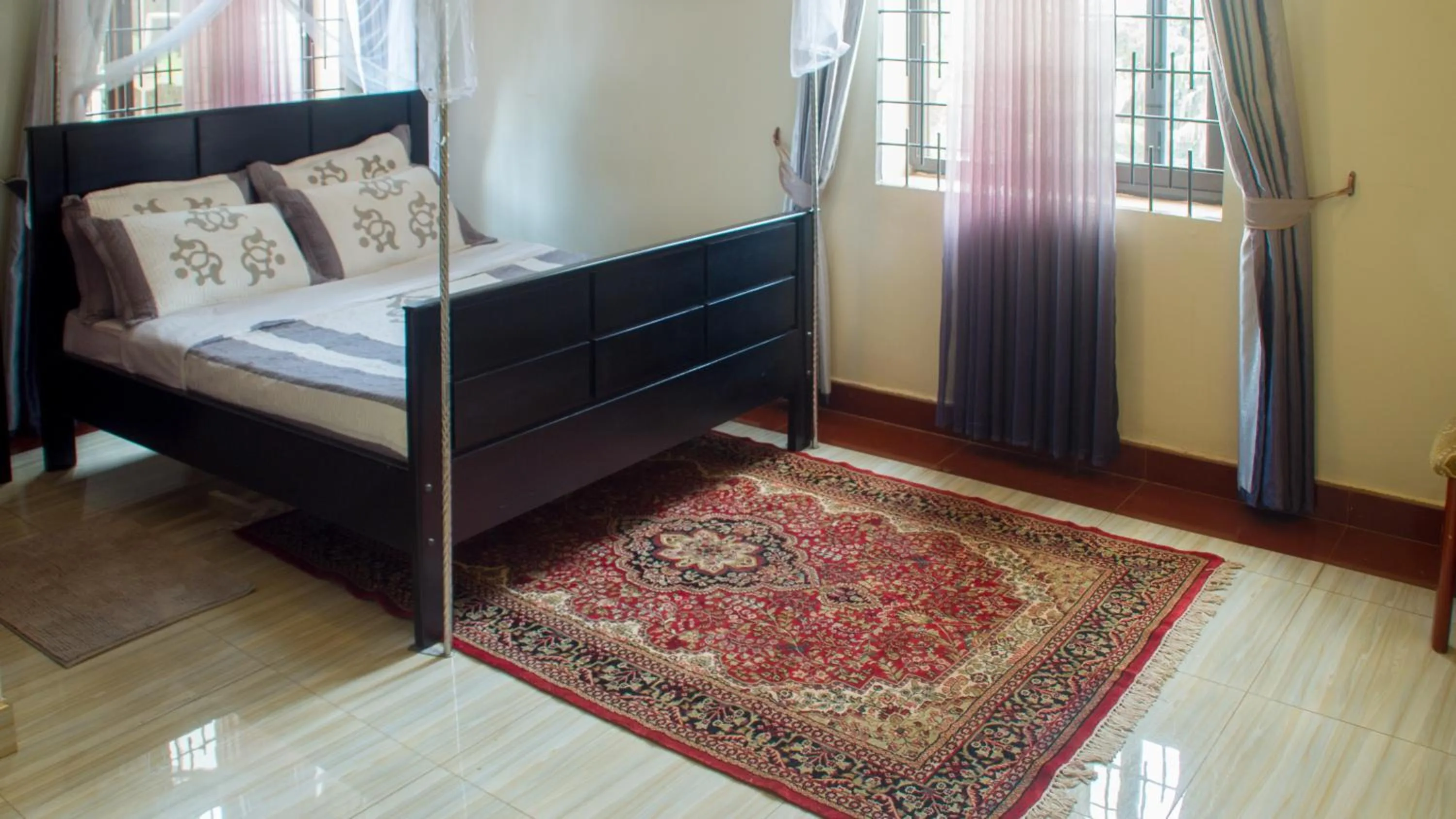 Bed in Bona Safari Villa Bunamwaya