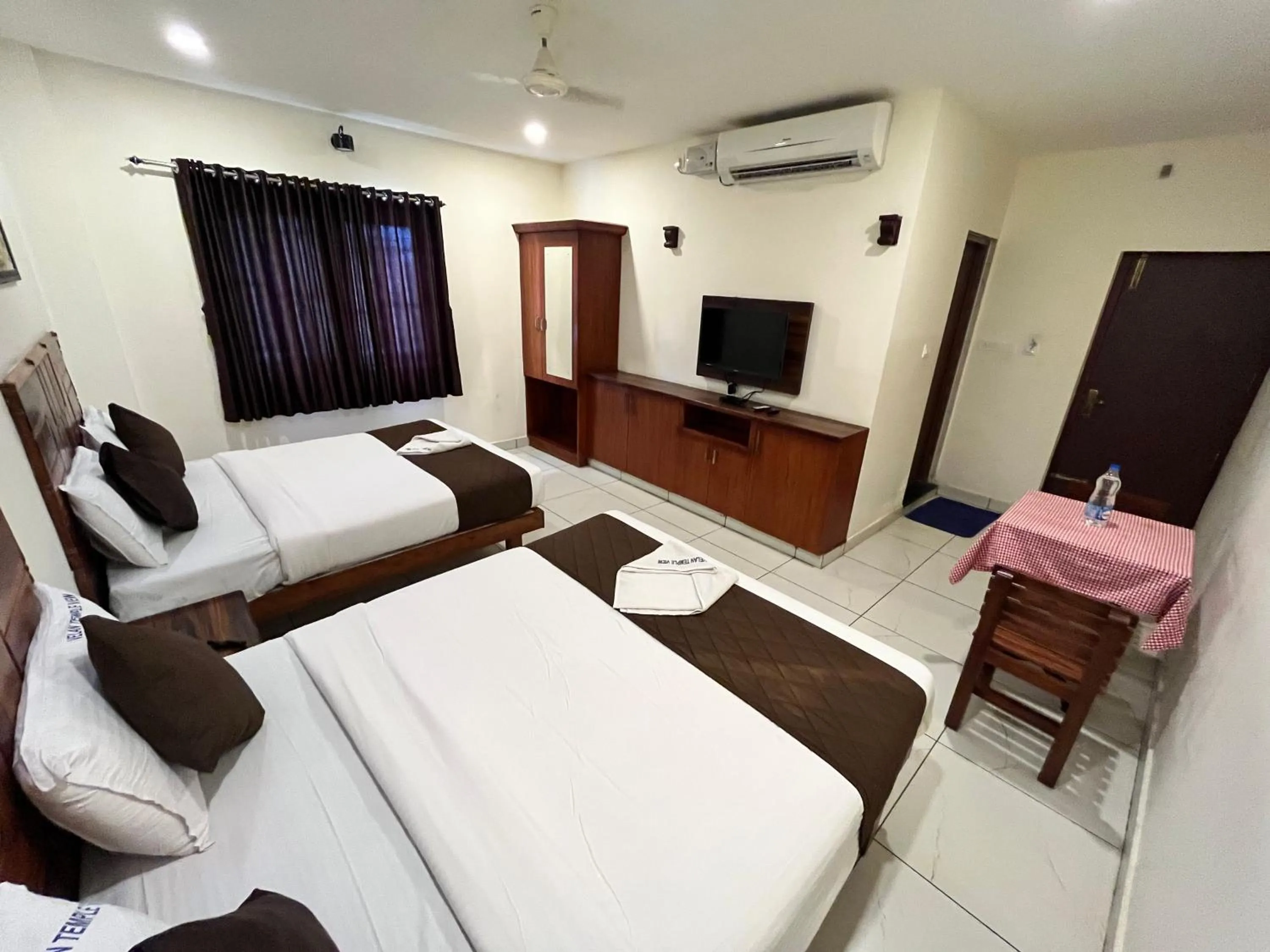 Pool view, Bed in Velan Temple View