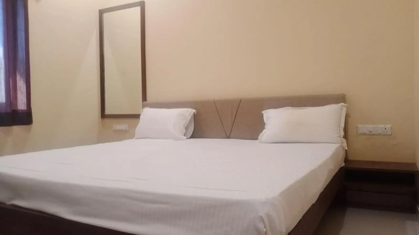 Bed in Vijayam Resort