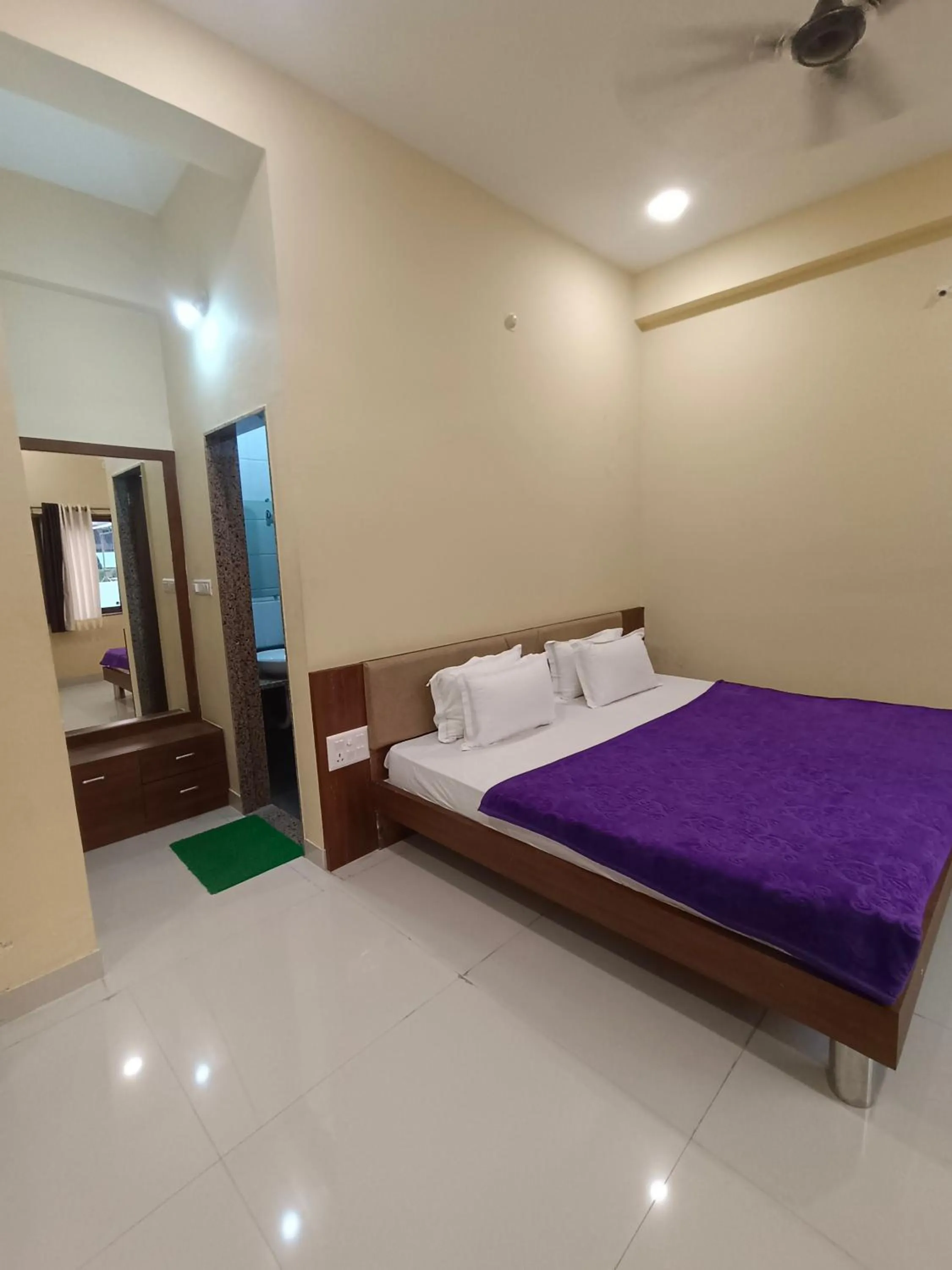 Bed in Vijayam Resort