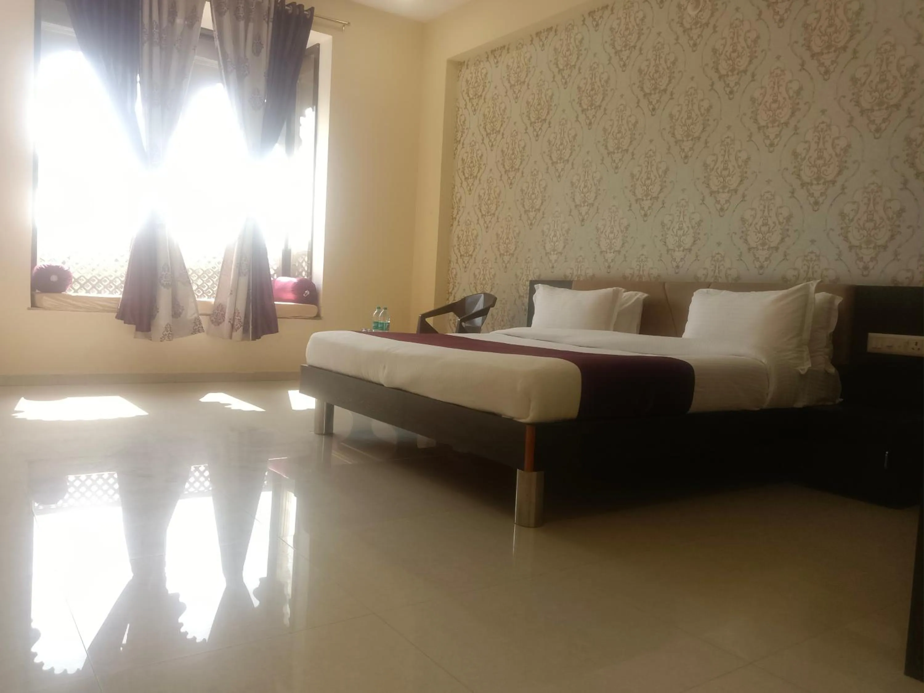 Bed in Vijayam Resort