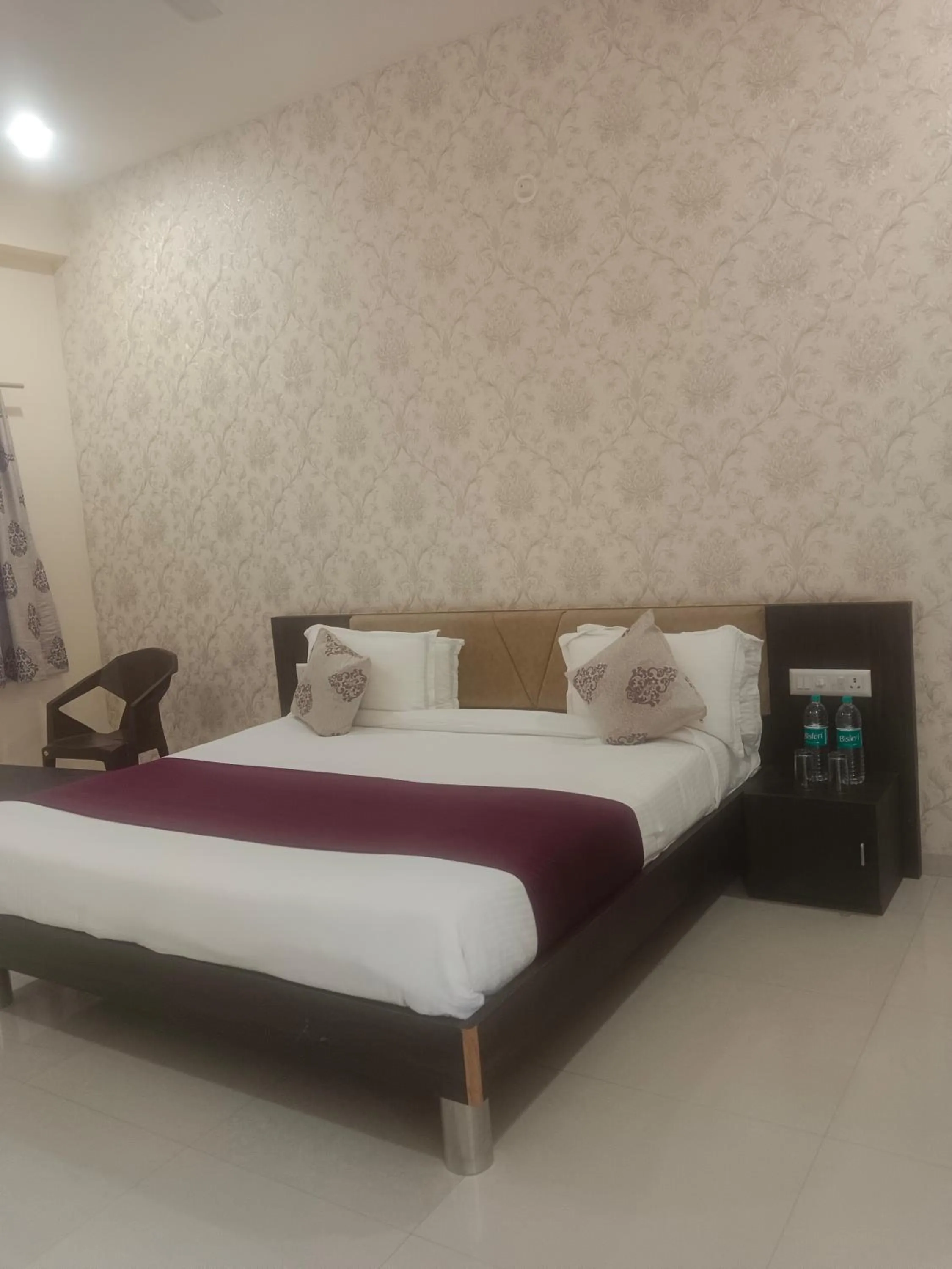 Bed in Vijayam Resort