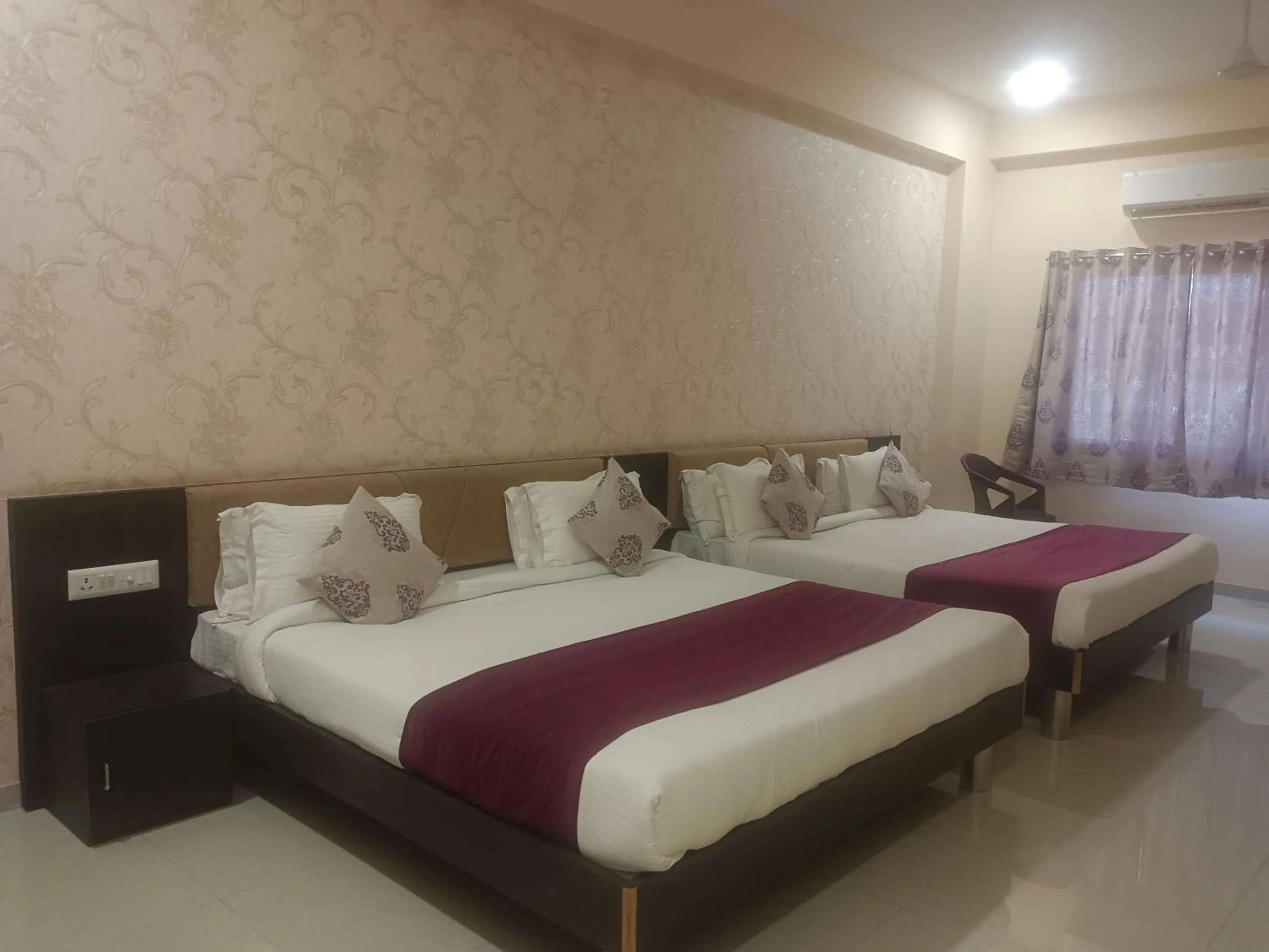 Bed in Vijayam Resort