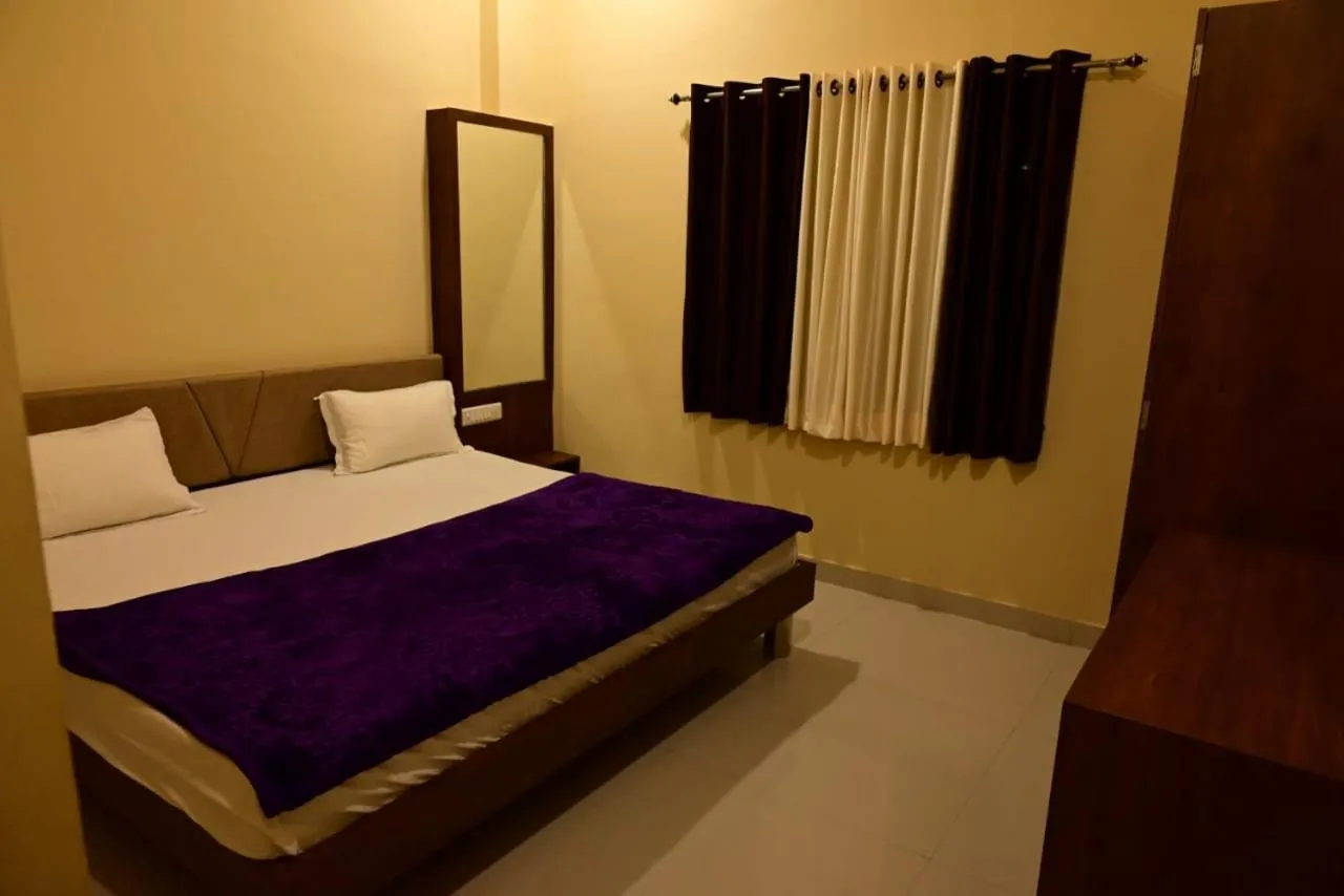 Bed in Vijayam Resort