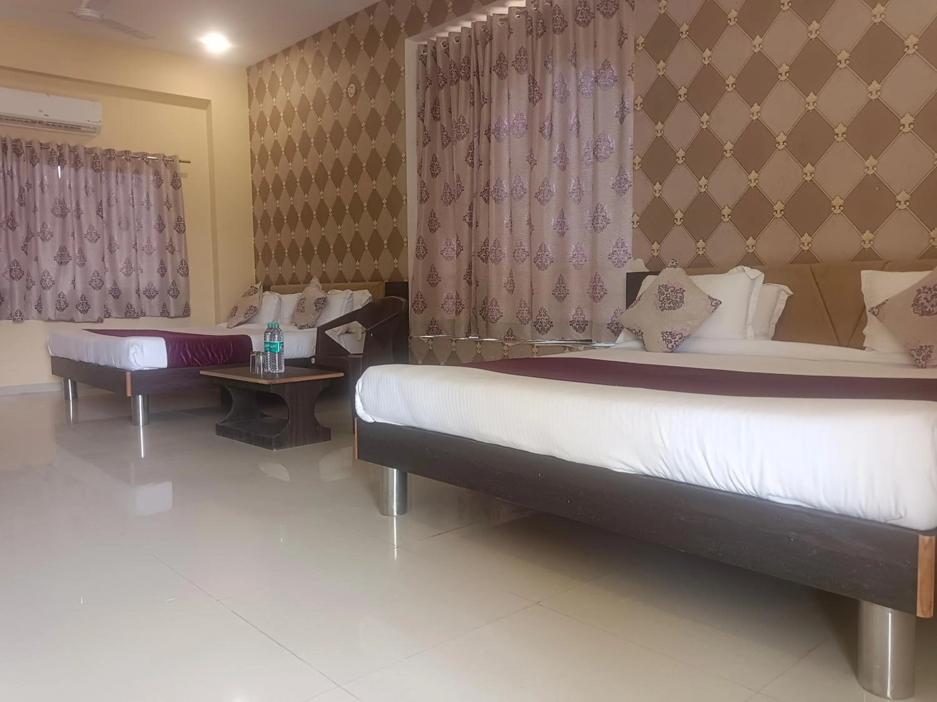 Bed in Vijayam Resort