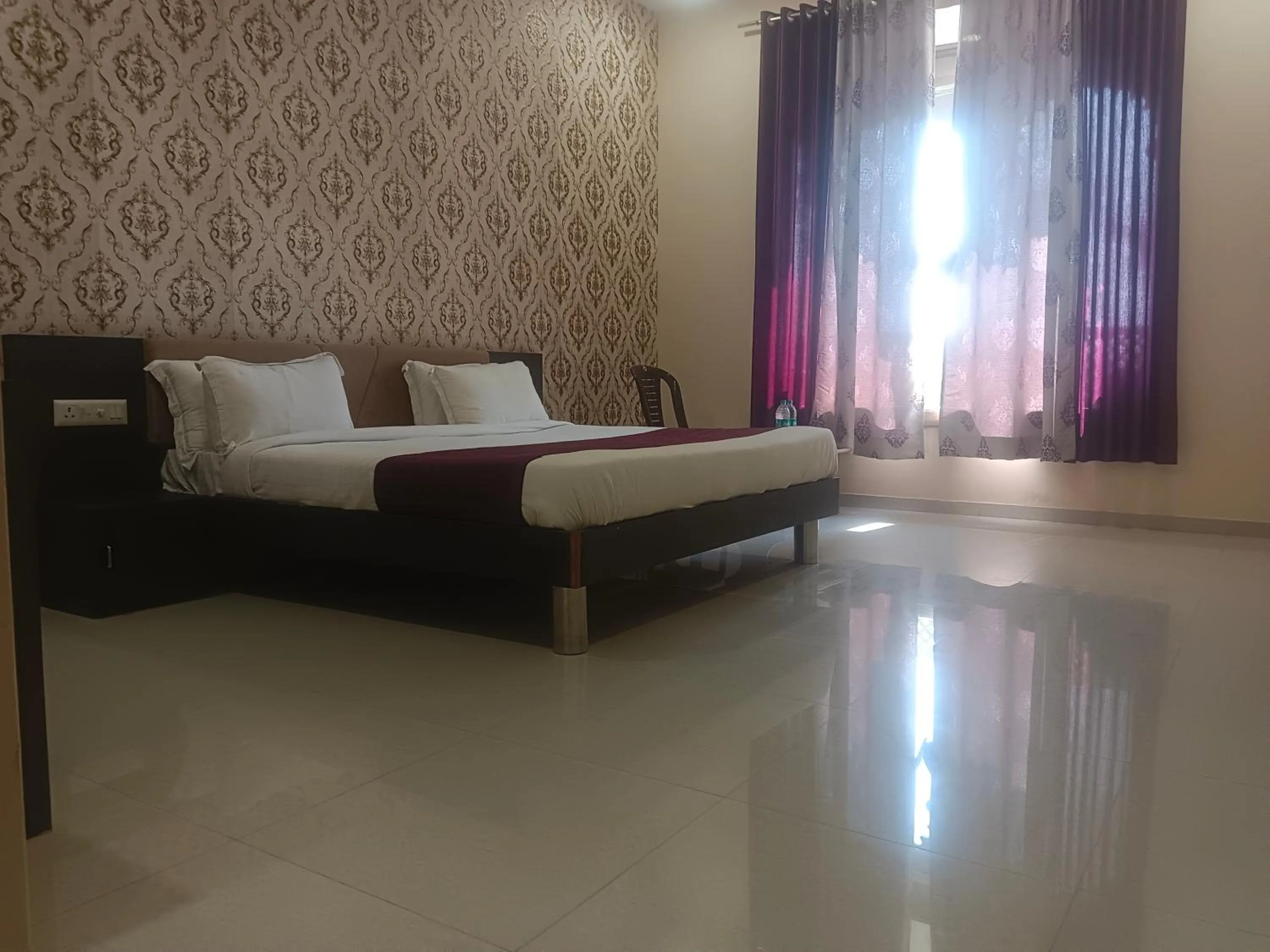 Bed in Vijayam Resort