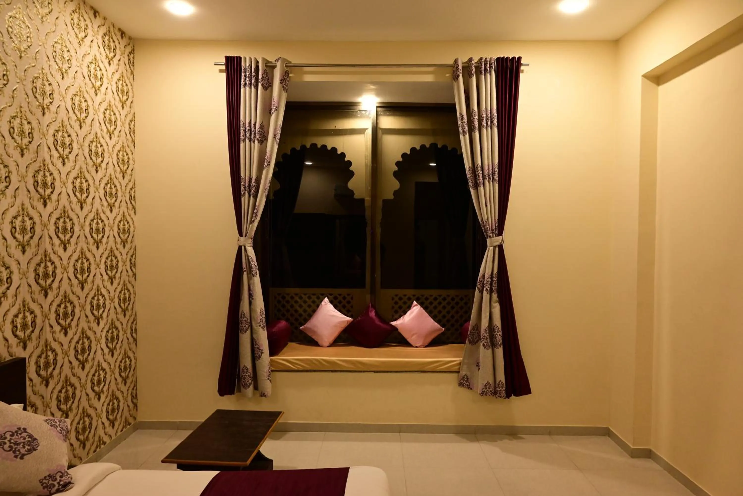 Seating area, Bed in Vijayam Resort