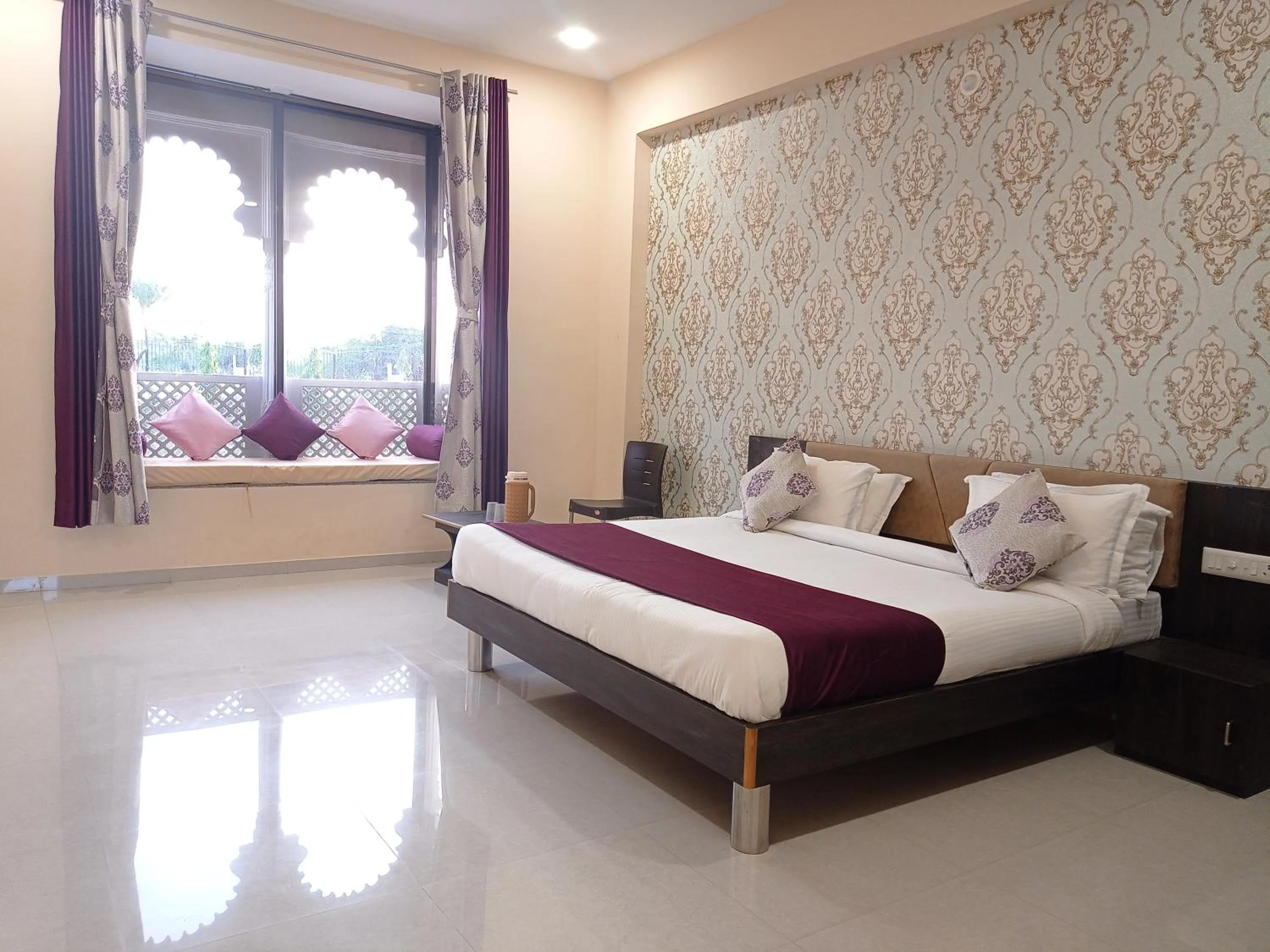 Bed in Vijayam Resort
