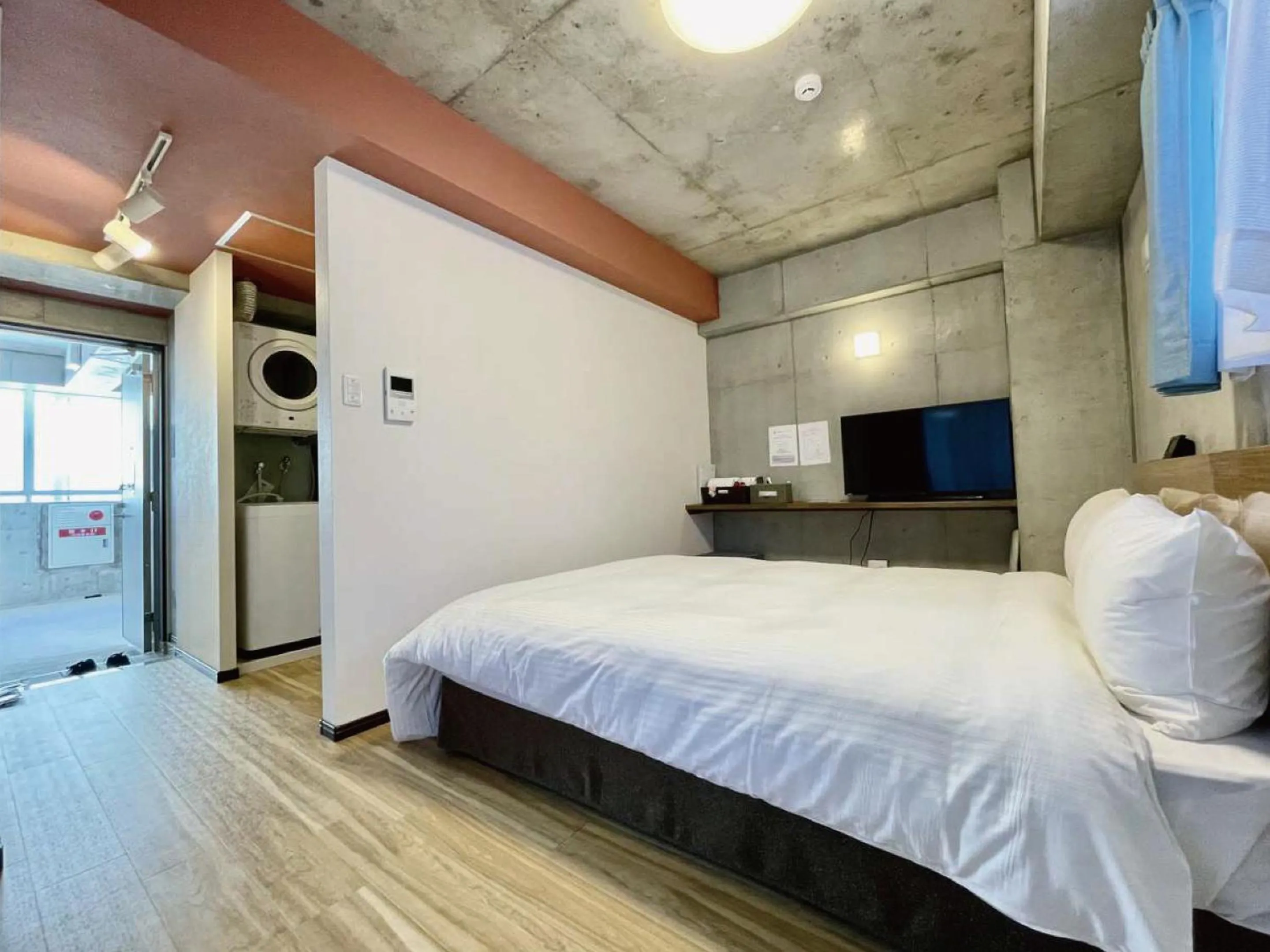 Bed in Infinity Hotel NahaKumoji -SEVEN Hotels and Resorts-