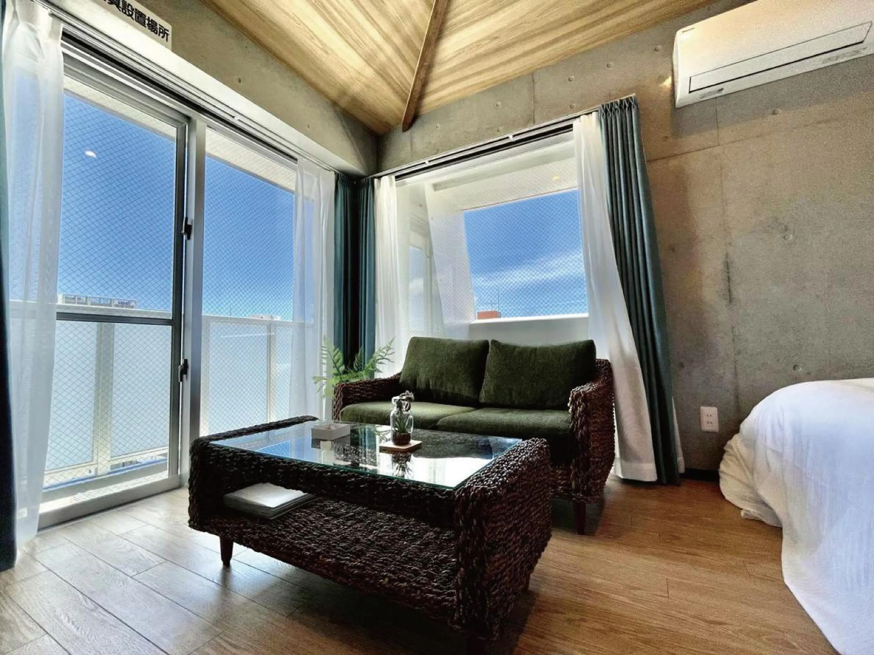 Living room, Bed in Infinity Hotel NahaKumoji -SEVEN Hotels and Resorts-