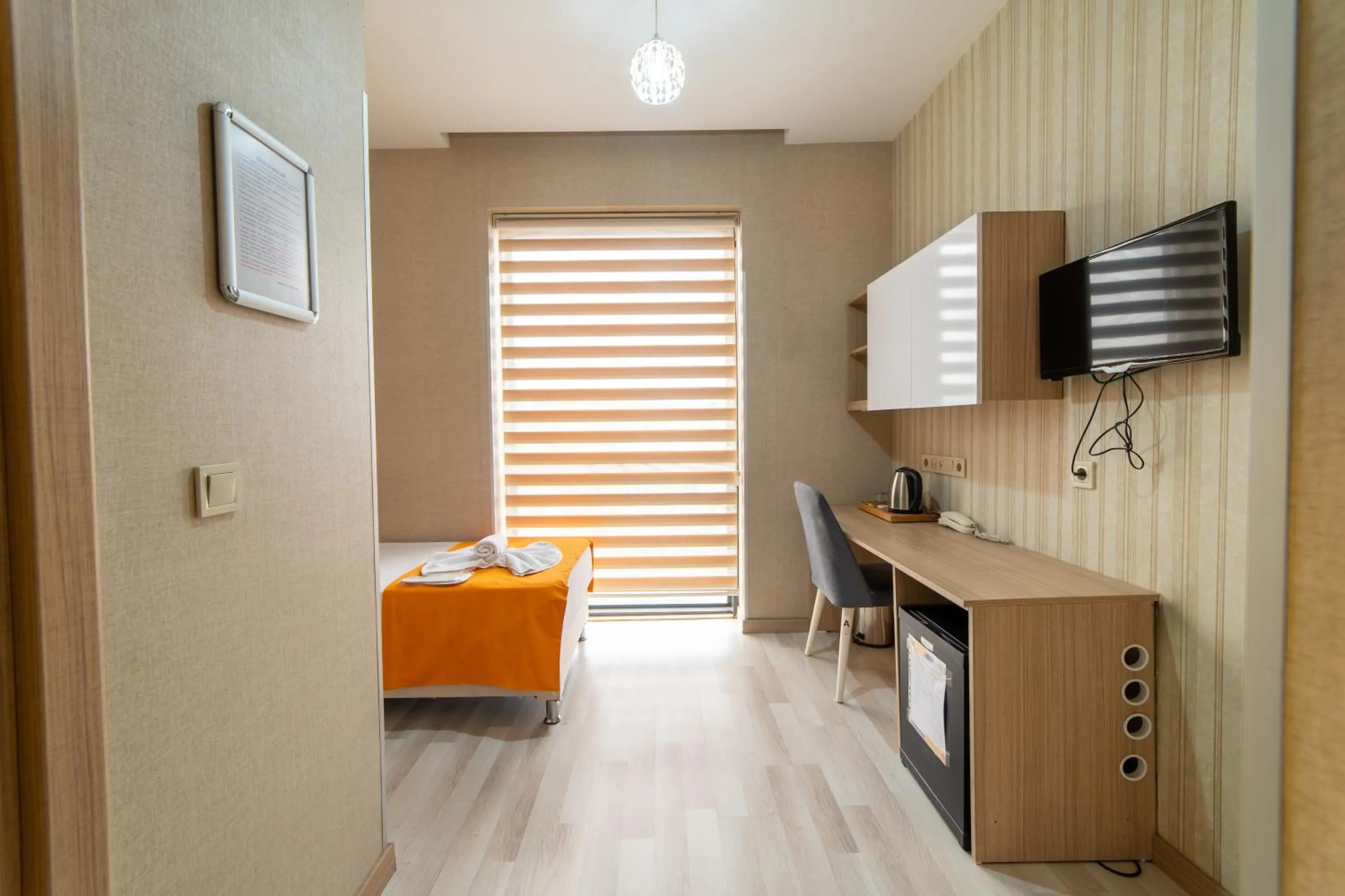 Bed in Mardy Suit Hotel