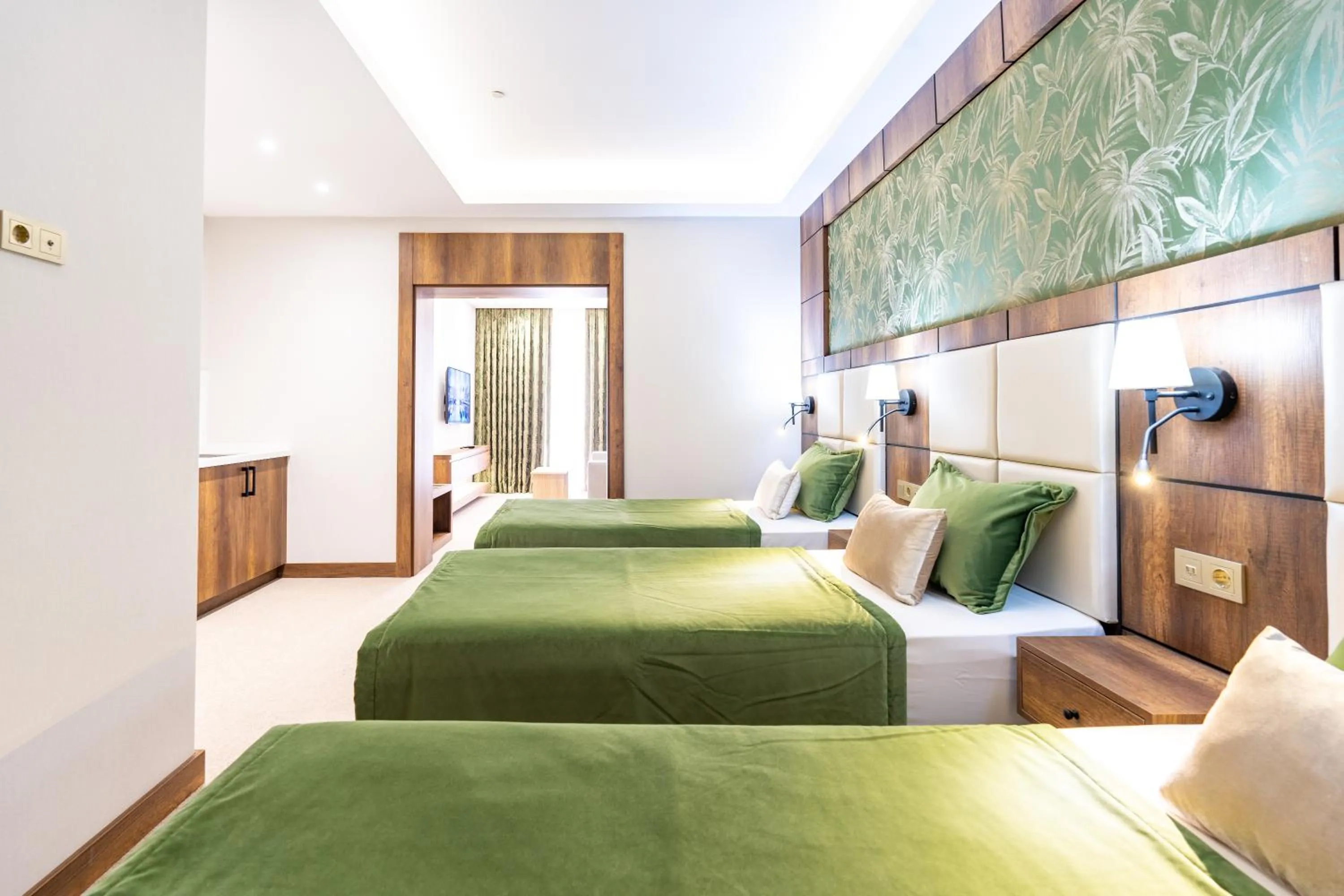 Bed in Mardy Suit Hotel