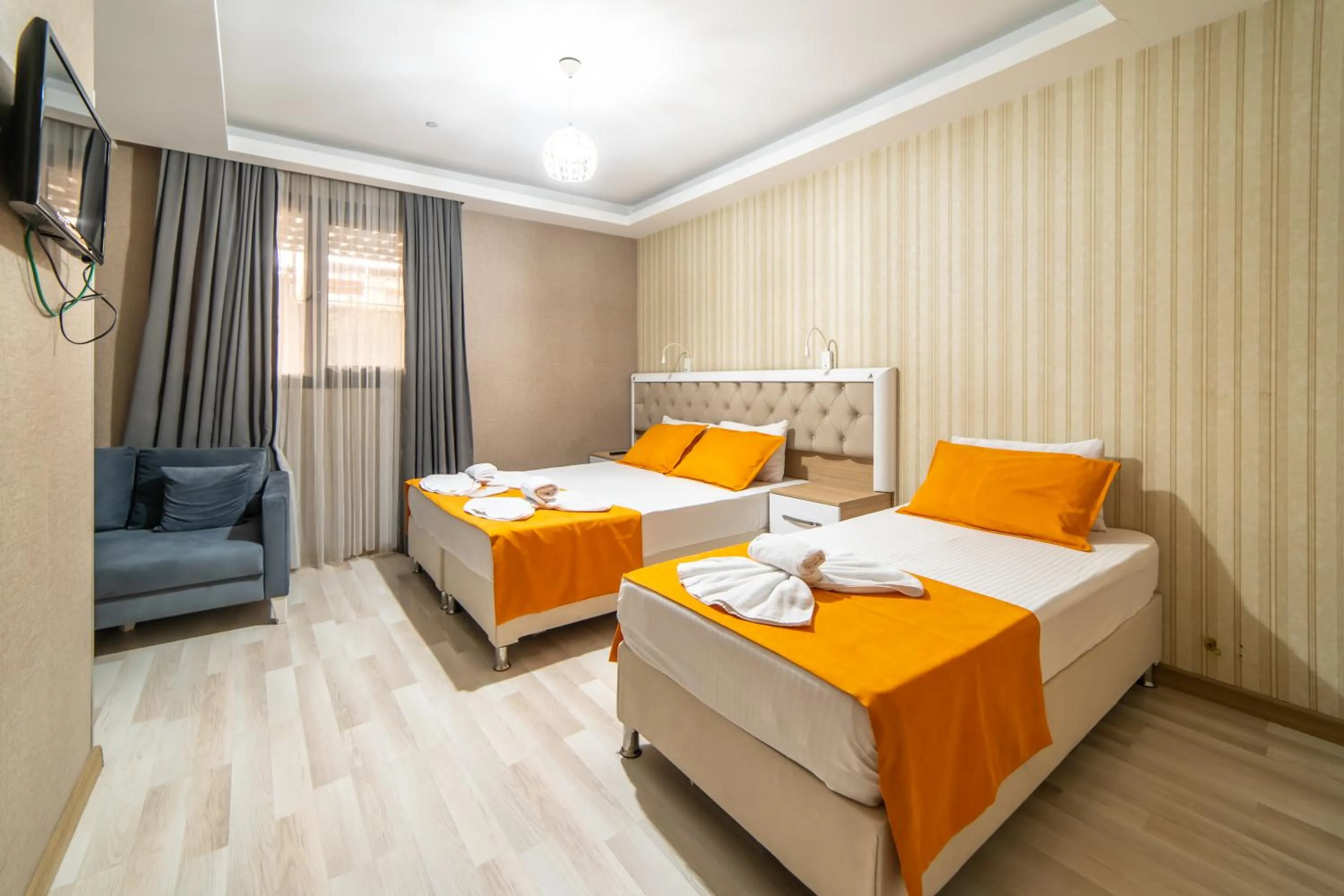 Bed in Mardy Suit Hotel