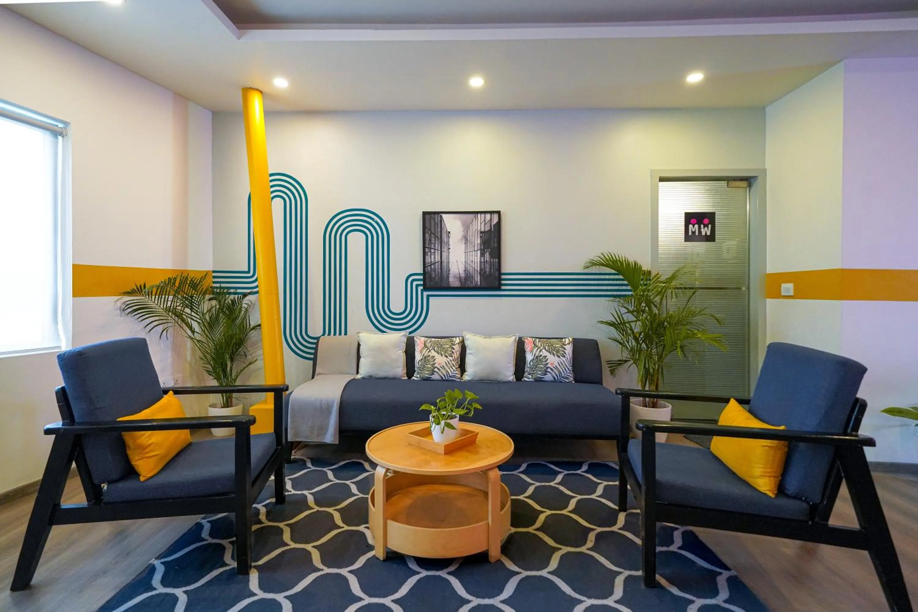 Seating area in Olive Hotel Indiranagar by Embassy Group