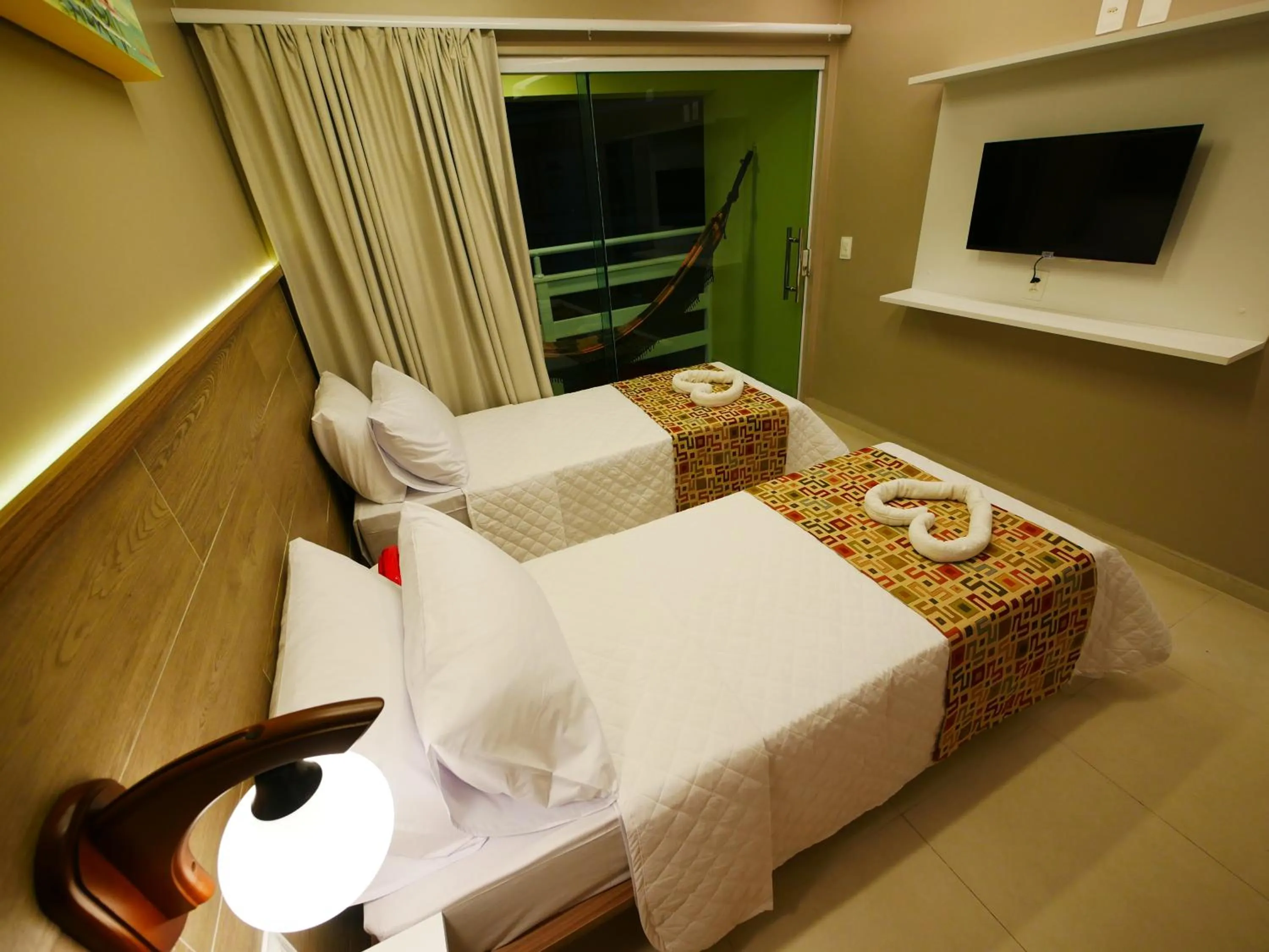 Bed in Pousada Recanto dos Corais