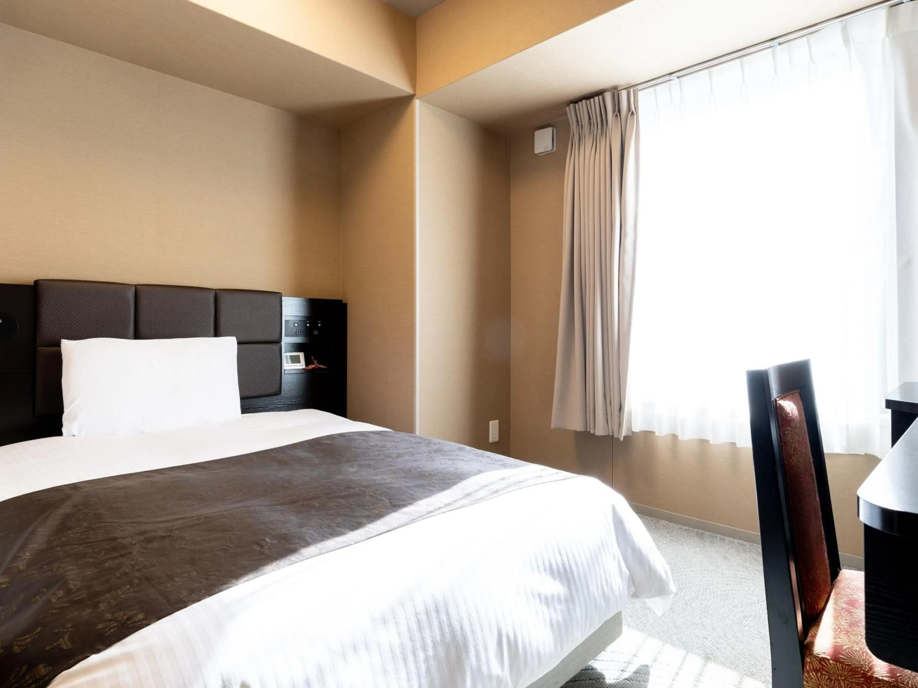 Photo of the whole room, Bed in APA Hotel Shin Osaka Ekimae Tower