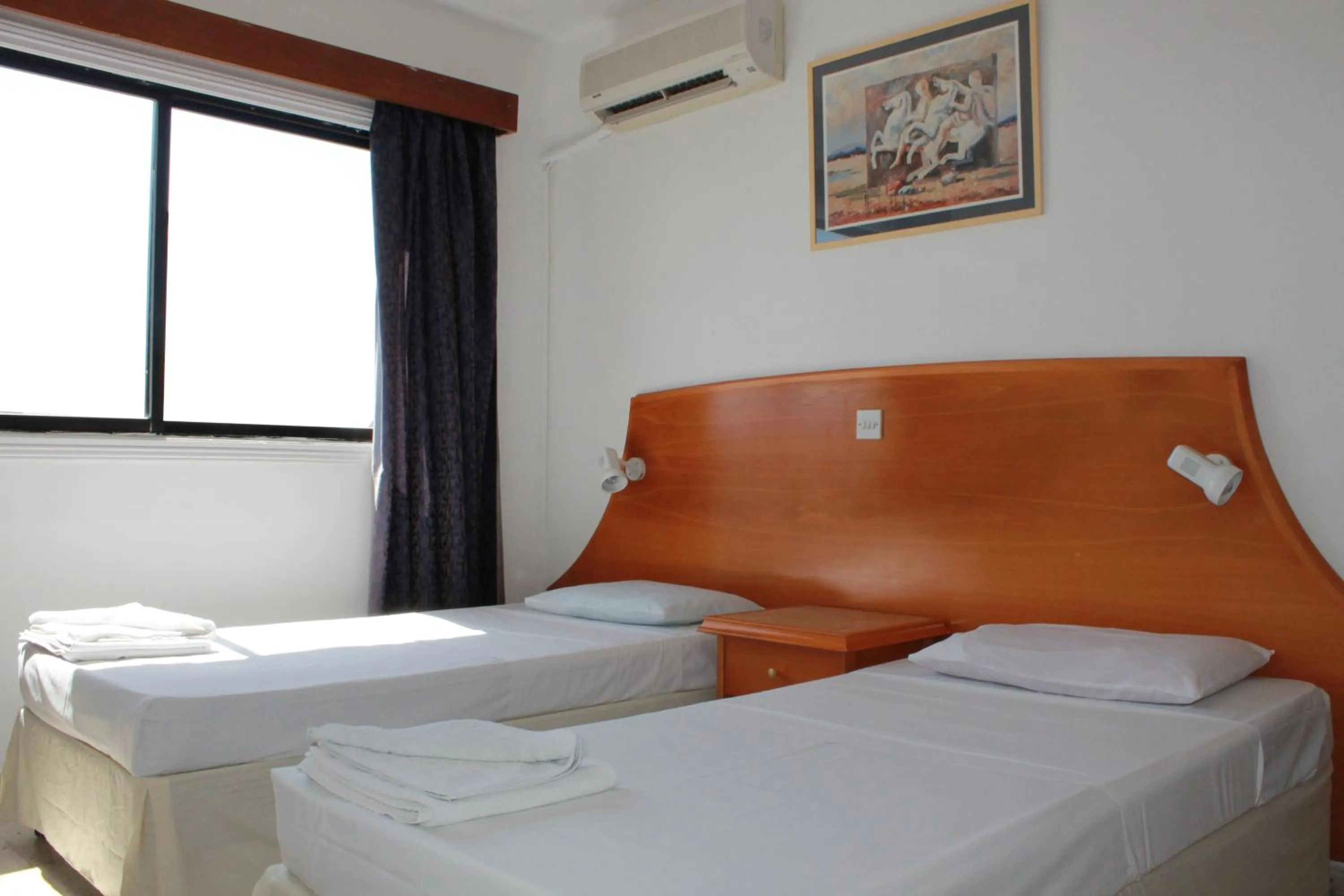Bed in Florea Hotel Apartments
