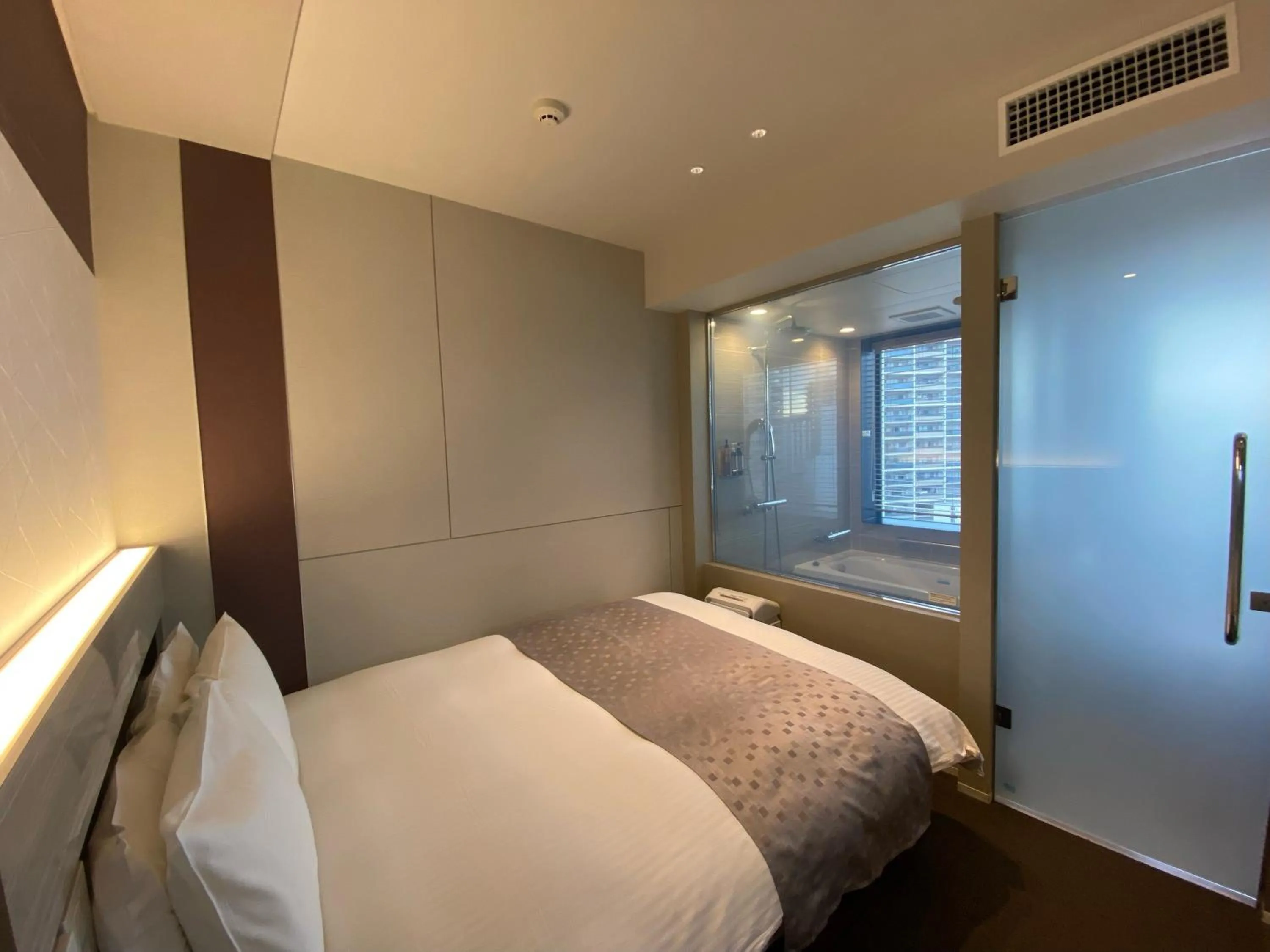 Bed in APA Hotel Keikyukamata Ekimae