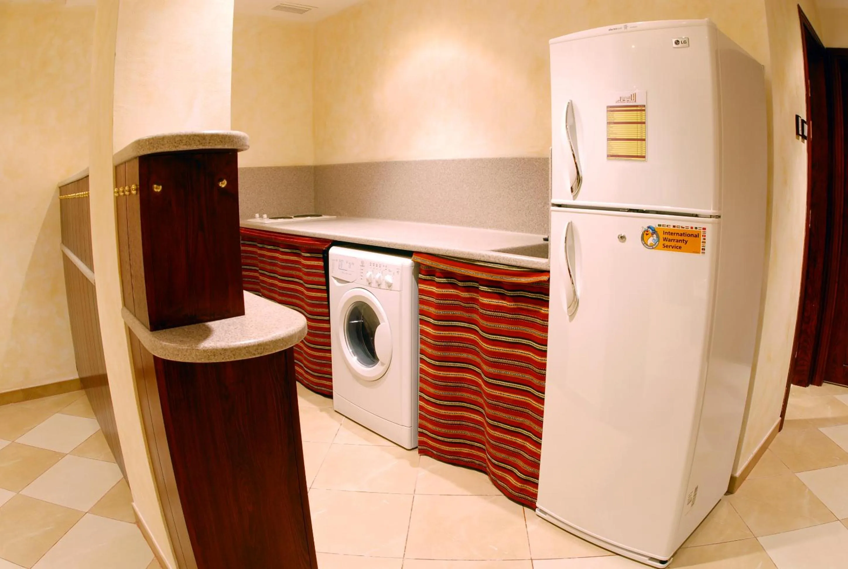 Kitchen or kitchenette in Al Liwan Suites