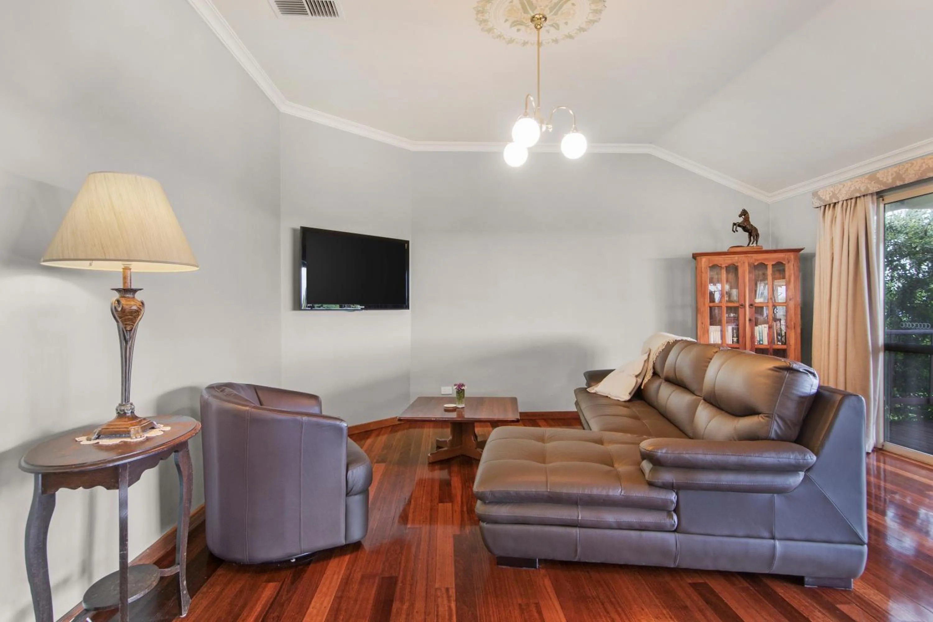 Communal lounge/ TV room in Shambhala Guesthouse