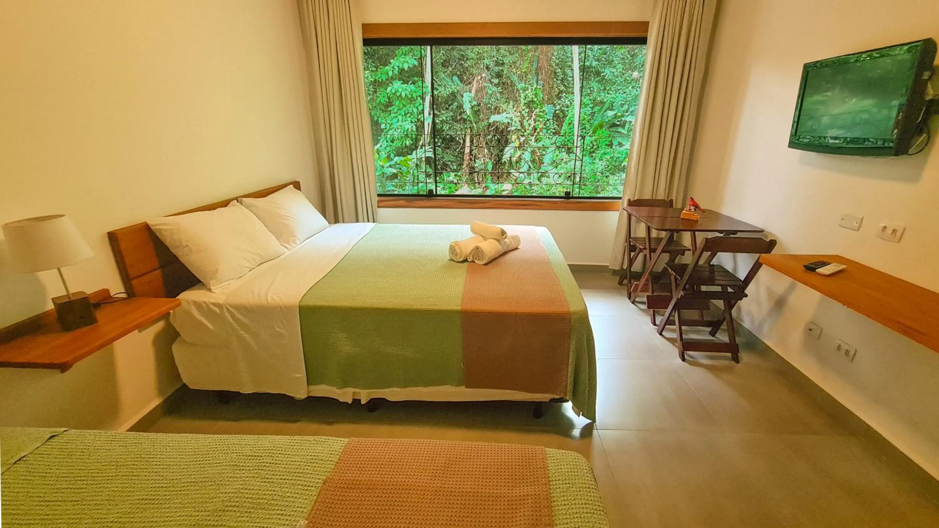 Bed in Canto dos Pássaros Suítes