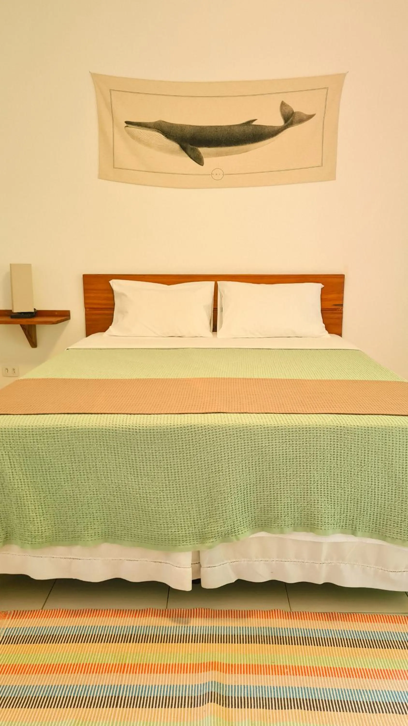 Bed in Canto dos Pássaros Suítes