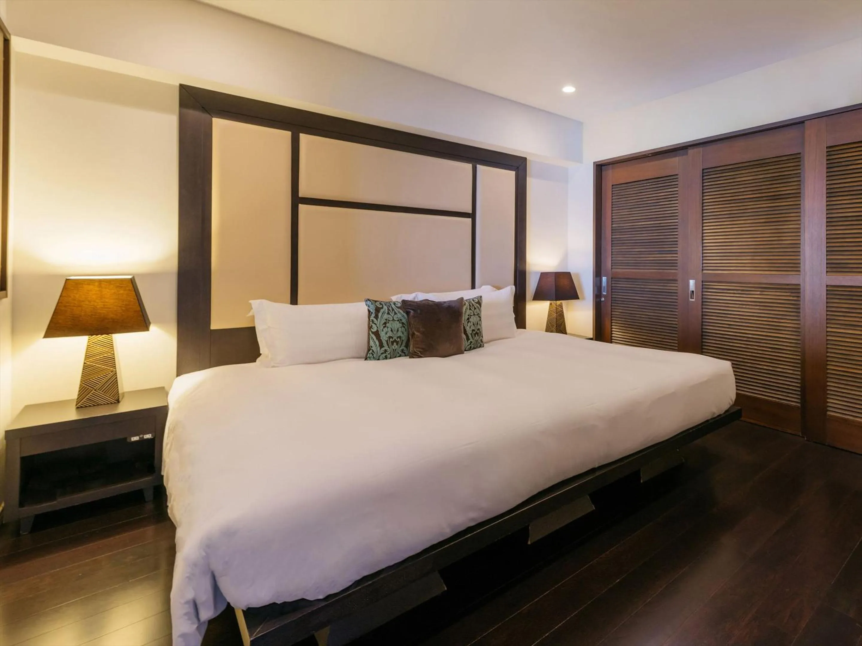 Bed in Kafuu Resort Fuchaku Condo Hotel