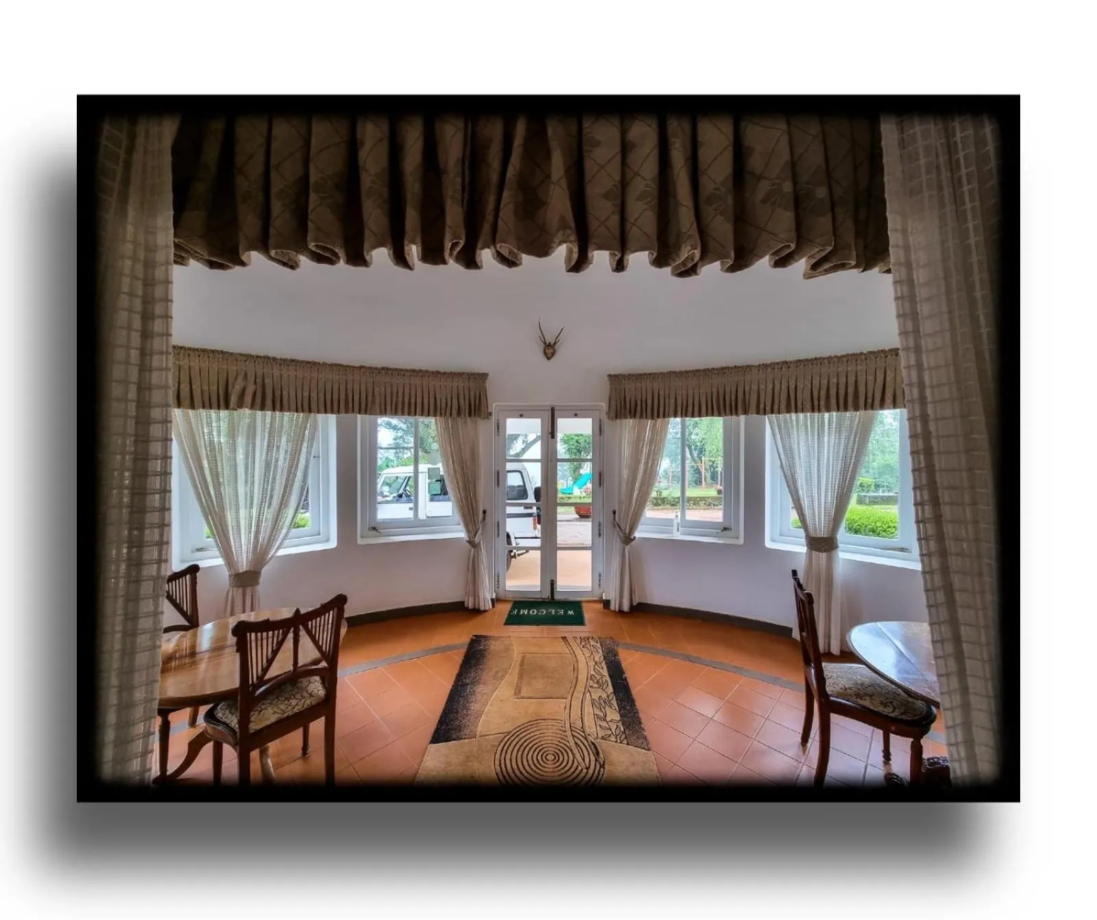 Seating area in Parisons Plantation Experiences by Abad