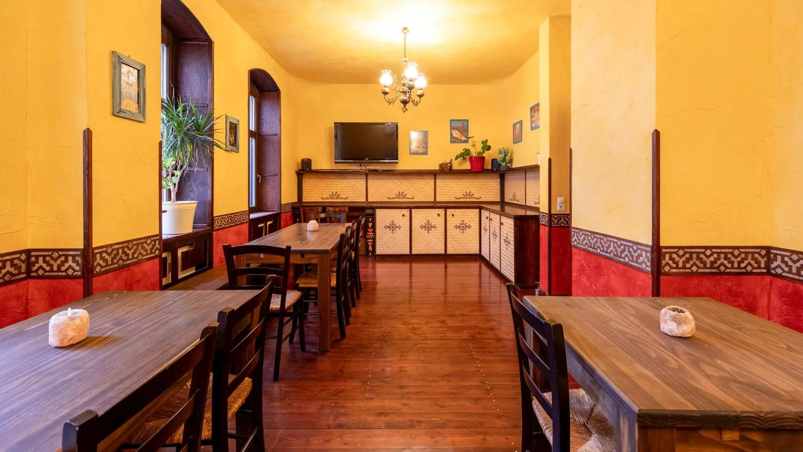 Communal lounge/ TV room in Gästehaus Mezcalero