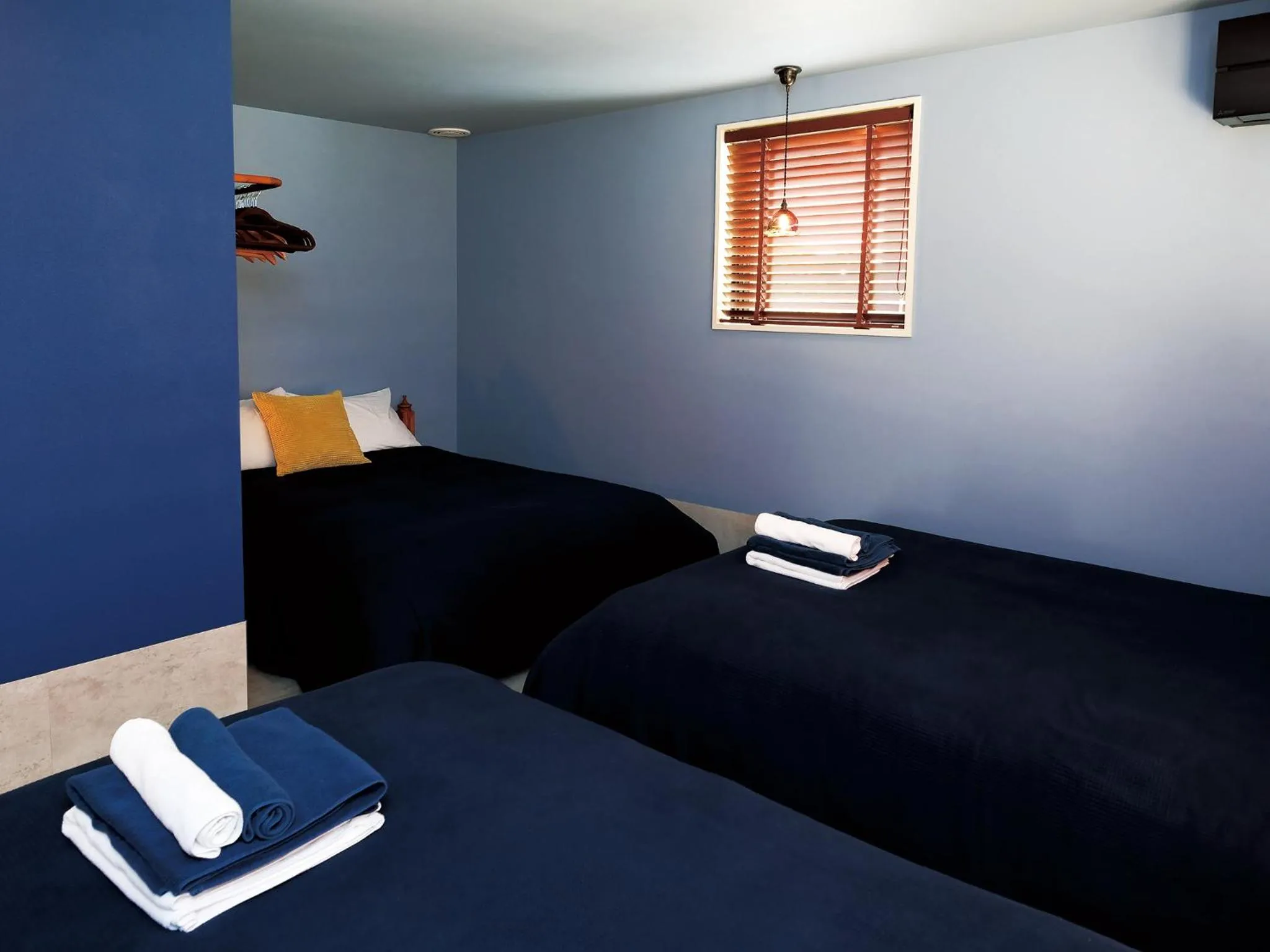 Bedroom, Bed in CHULAX OKINAWA YOMITAN【Designer Condominium Hotel】