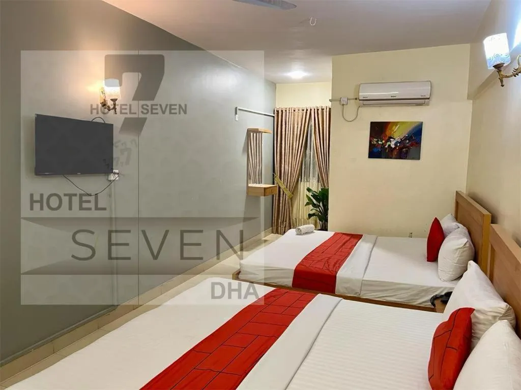 Communal lounge/ TV room, Bed in Hotel 7 DHA