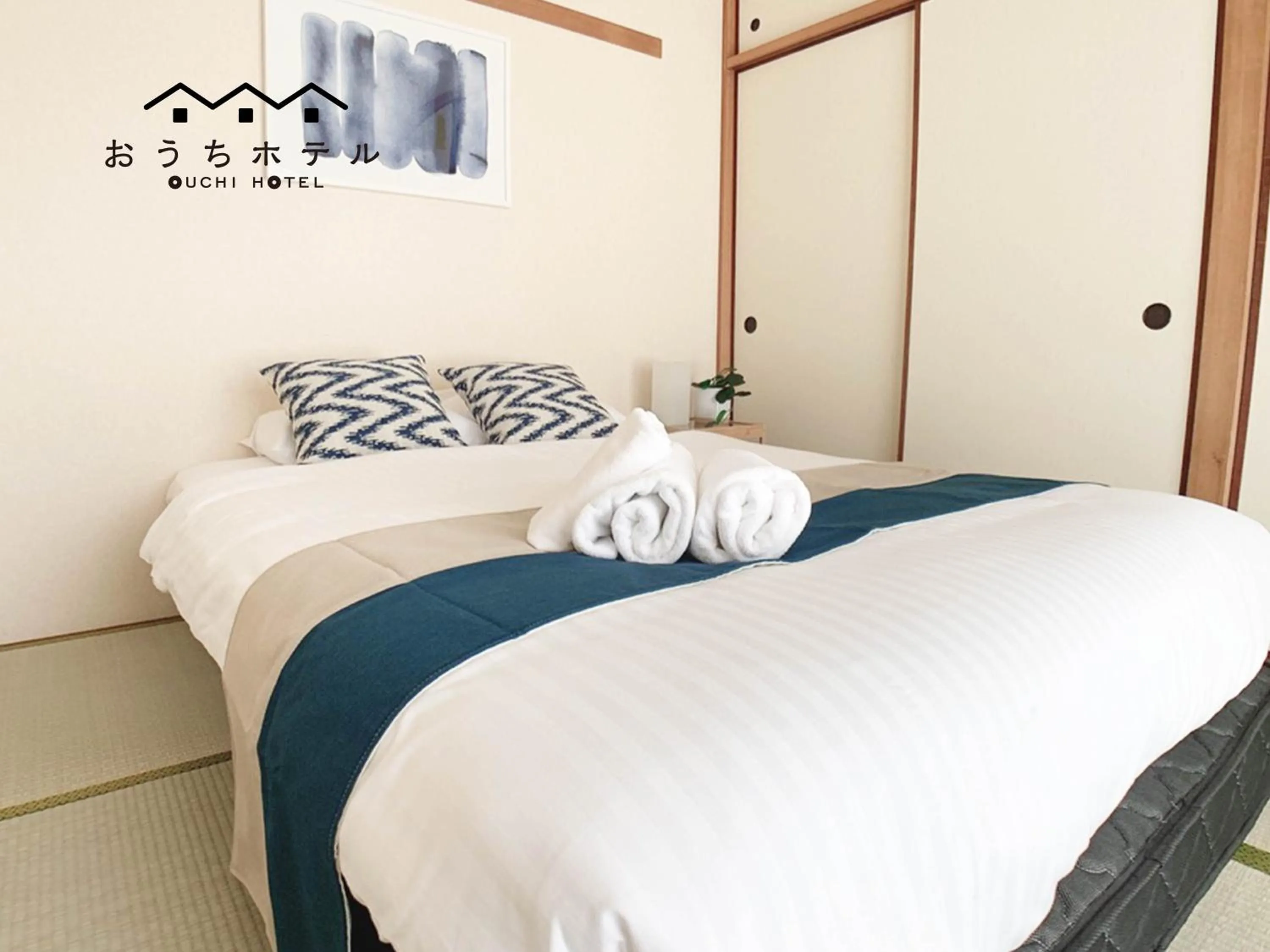 Bed in OUCHI HOTEL Hijiyama