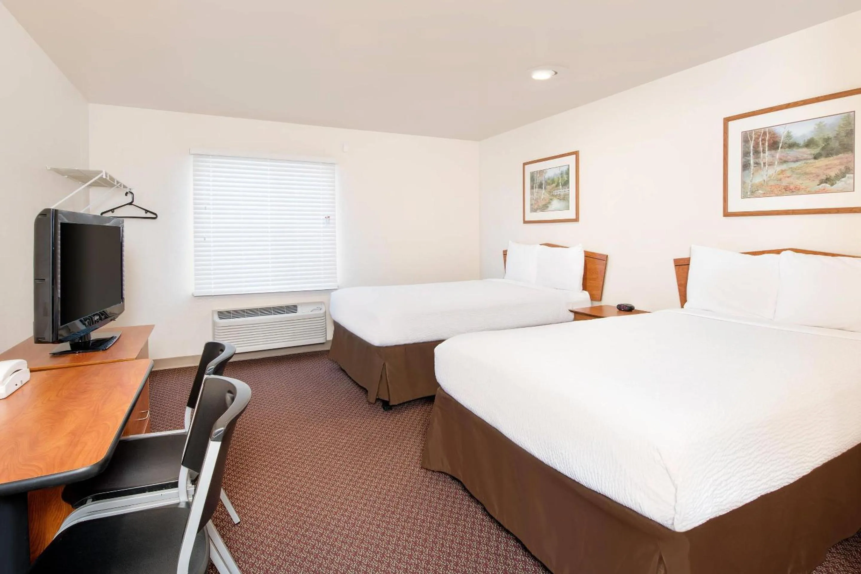 Bedroom, Bed in WoodSpring Suites Columbus near Fort Benning