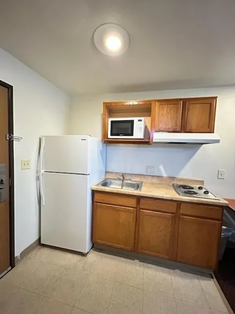 kitchen in WoodSpring Suites Columbus near Fort Benning