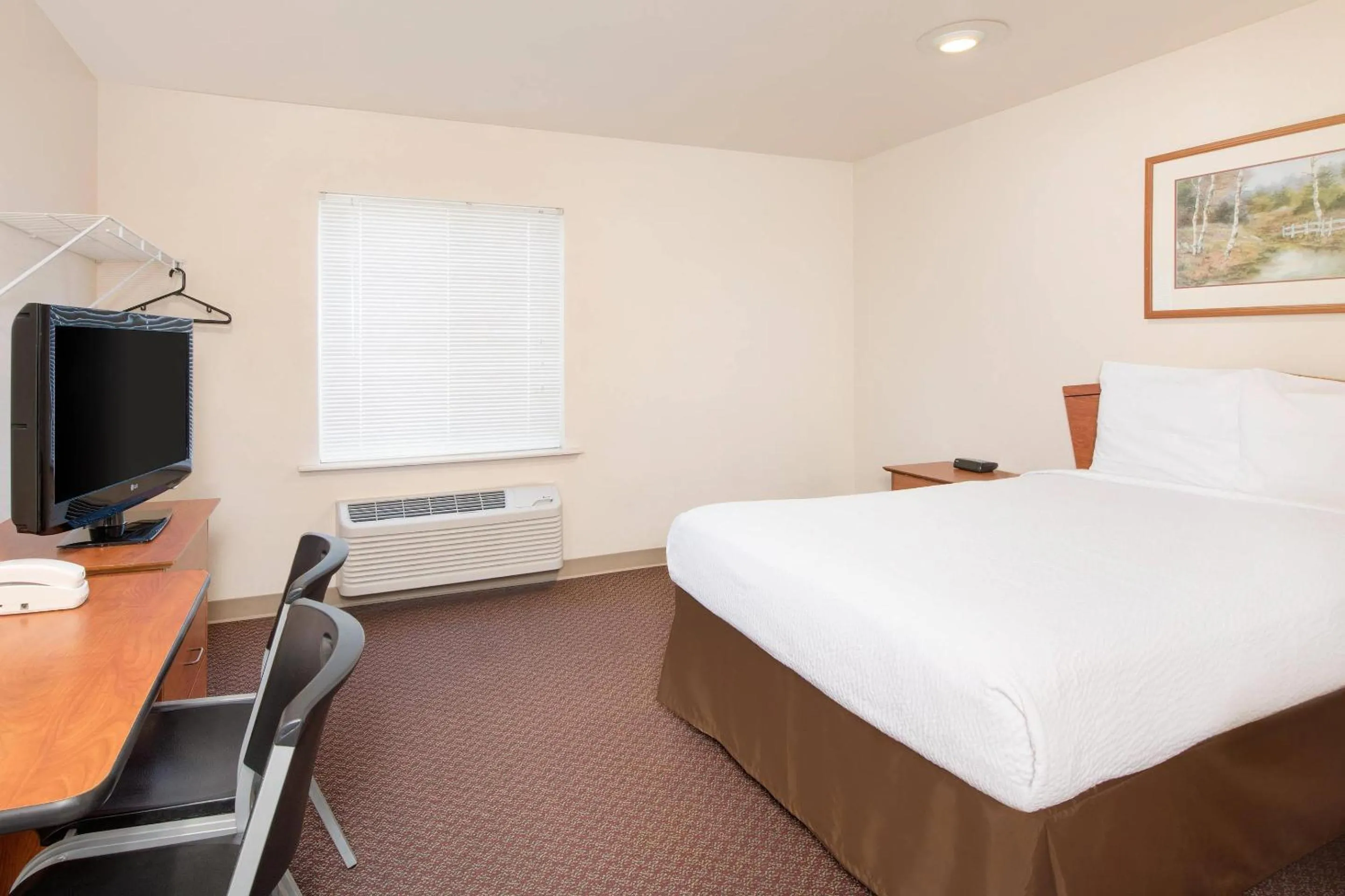 Bedroom, Bed in WoodSpring Suites Columbus near Fort Benning