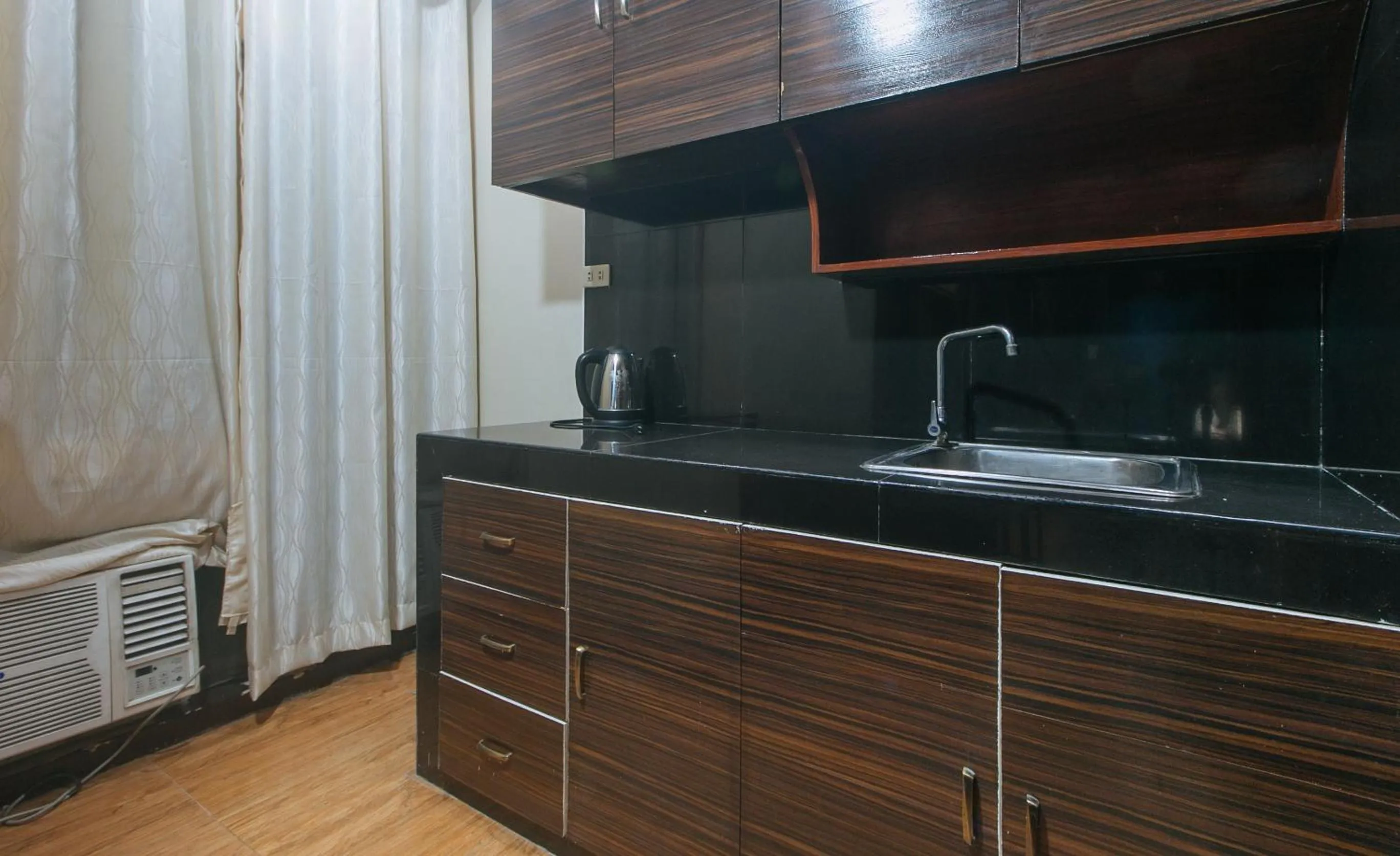 Kitchen or kitchenette in RedDoorz Plus at Canley Residential