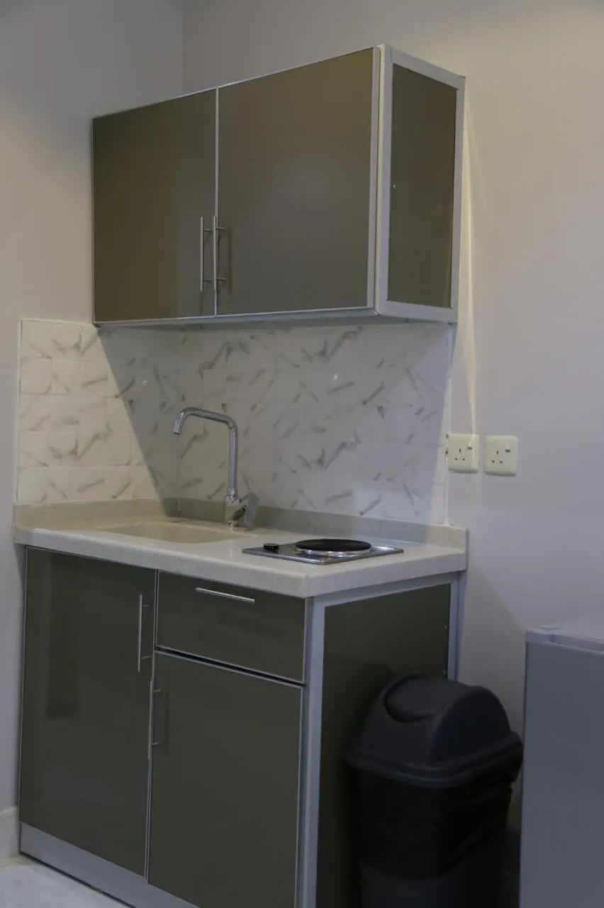 Kitchen or kitchenette in Areen Al Naeem Served Apartments